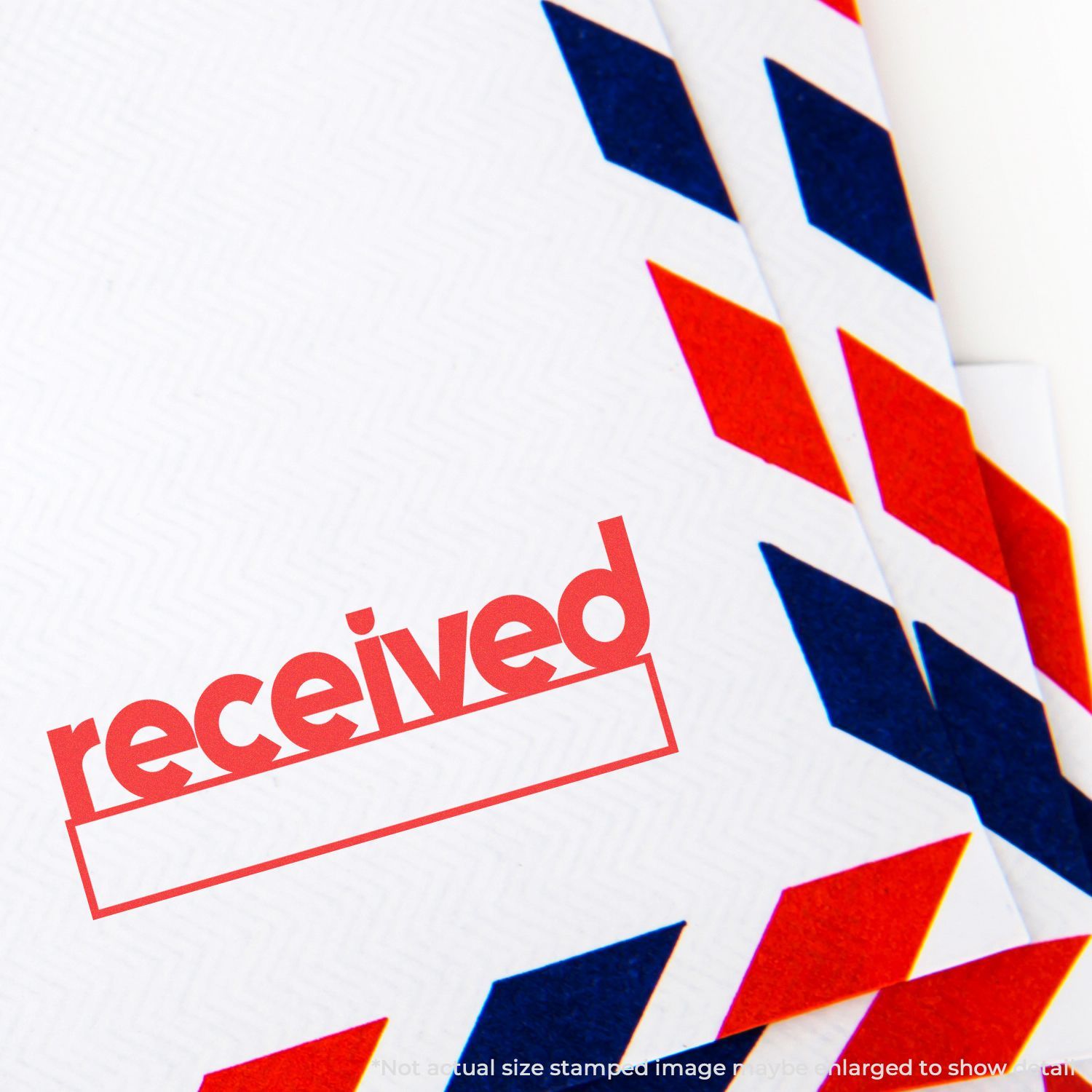 Close-up of a received stamp on a red and blue airmail envelope.