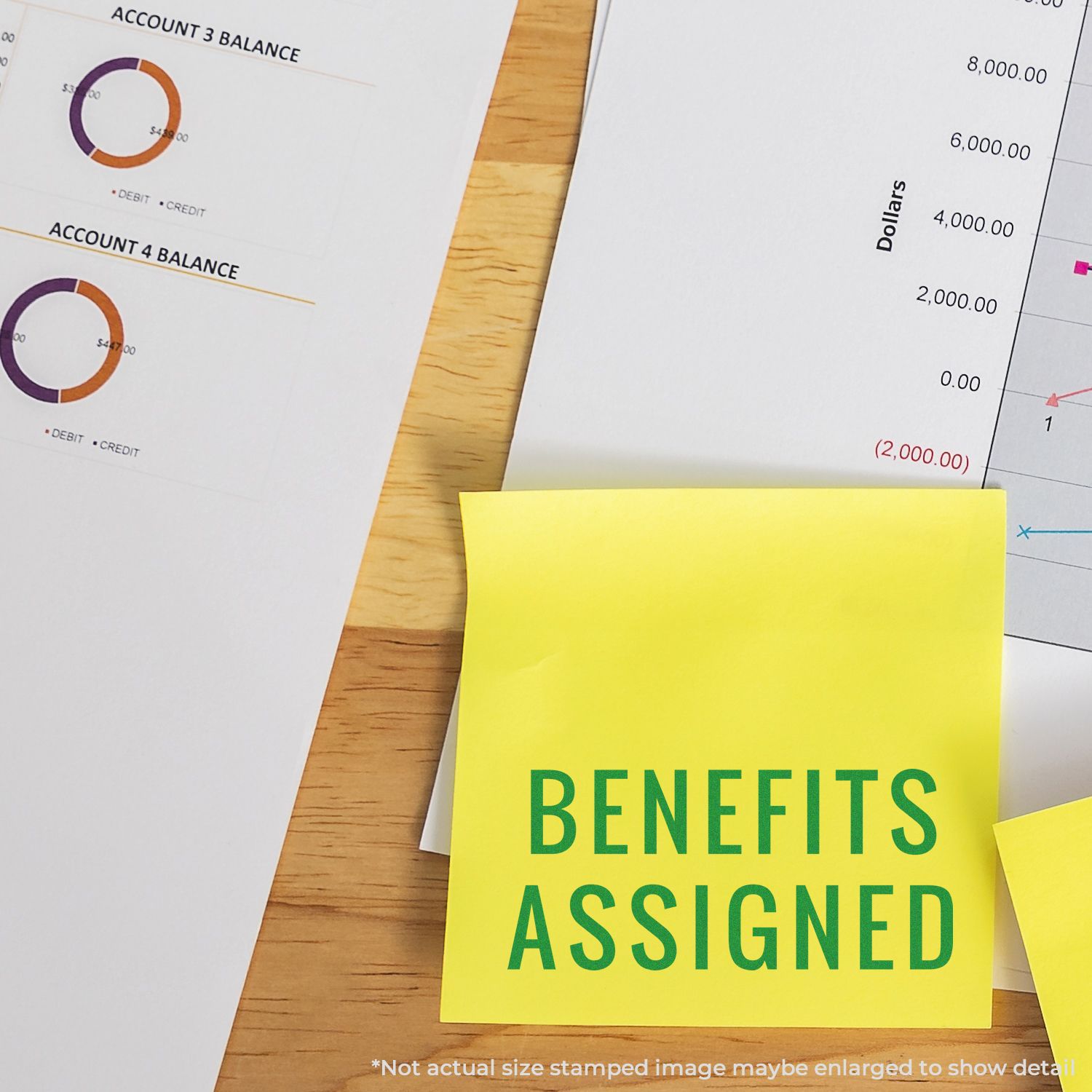 Sticky note reading Benefits Assigned beside accounting balance charts and dollar amounts, highlighting financial planning analysis