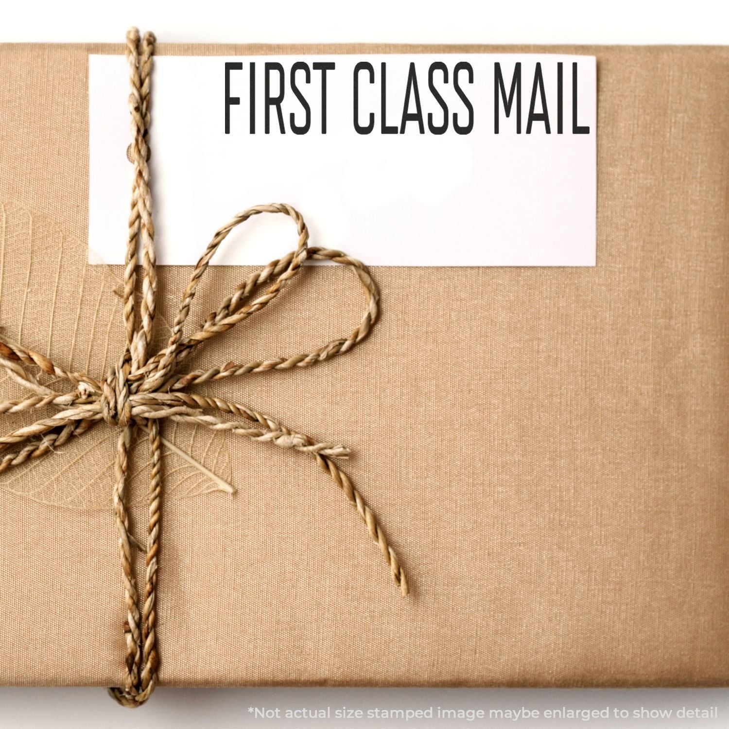 First Class Mail shipping label on tied cardboard package, highlighting fast USPS delivery service and priority mailing today.