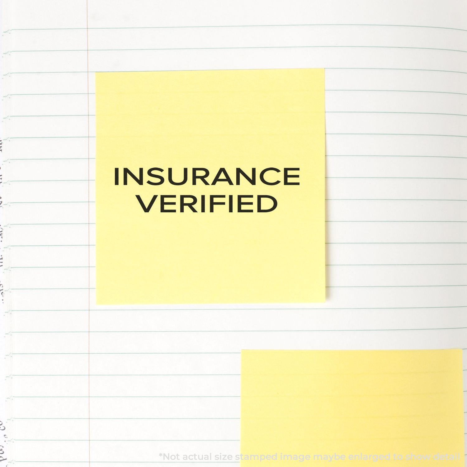 Yellow sticky note reading INSURANCE VERIFIED on lined paper, confirming insurance coverage verification for documentation.