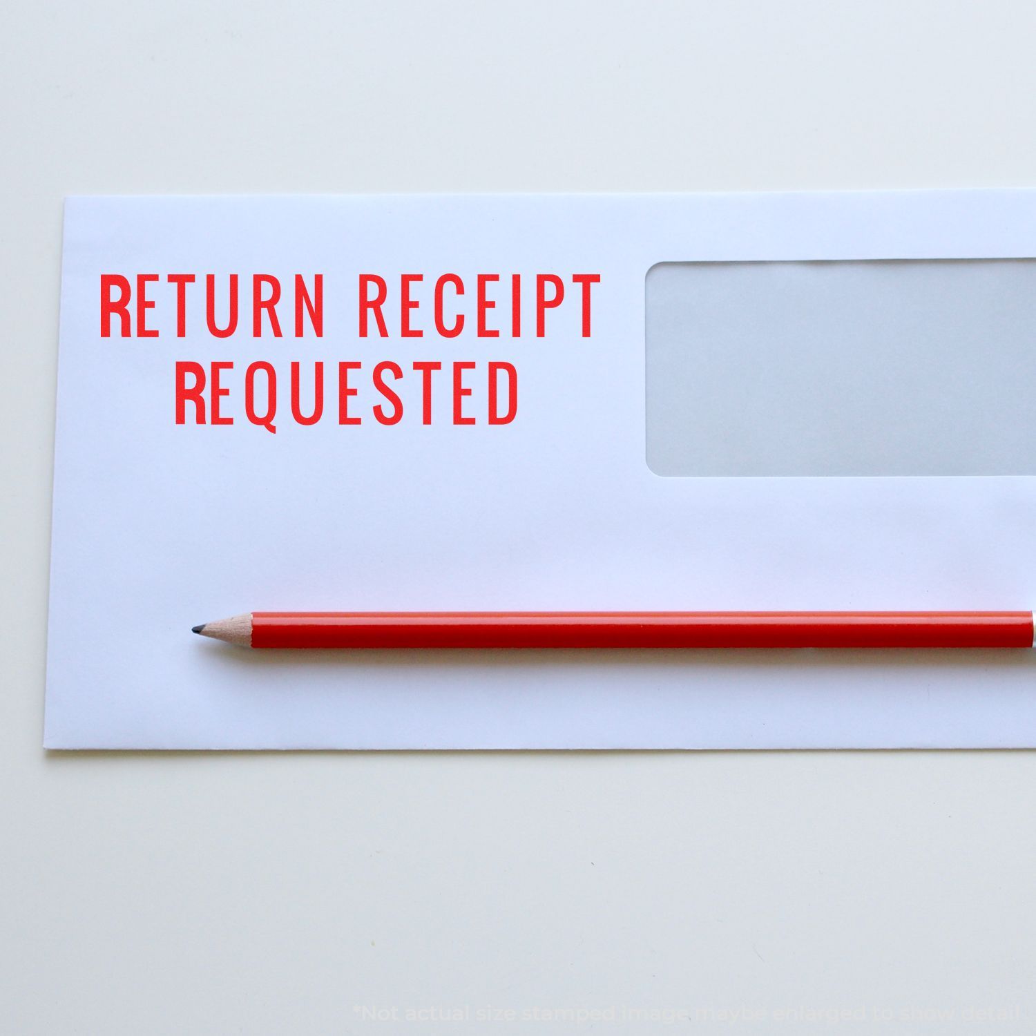 Return receipt requested envelope with red pencil on white background, certified mail delivery concept.