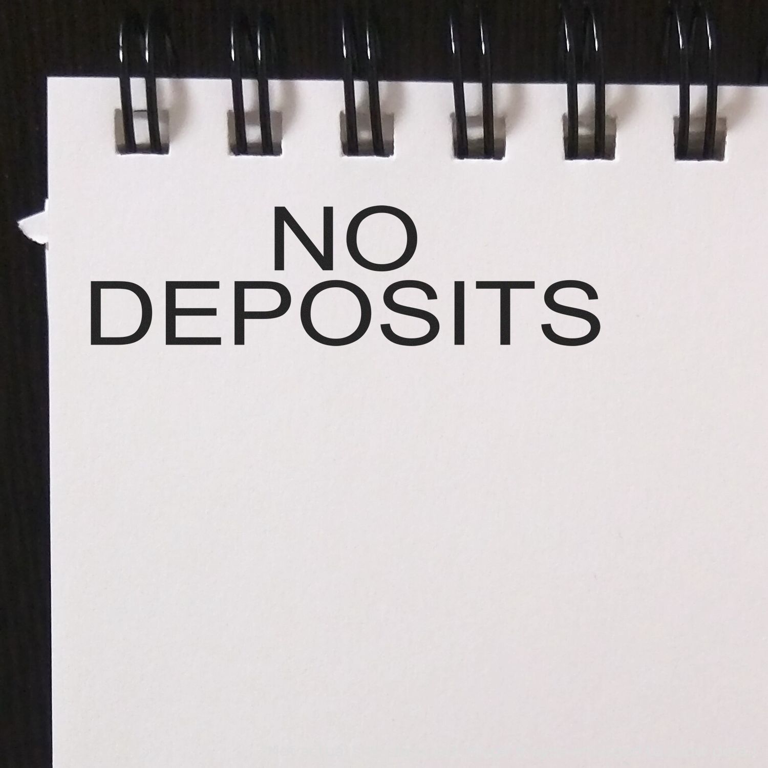 No deposits sign on storage container, warning that deposits are not accepted.
