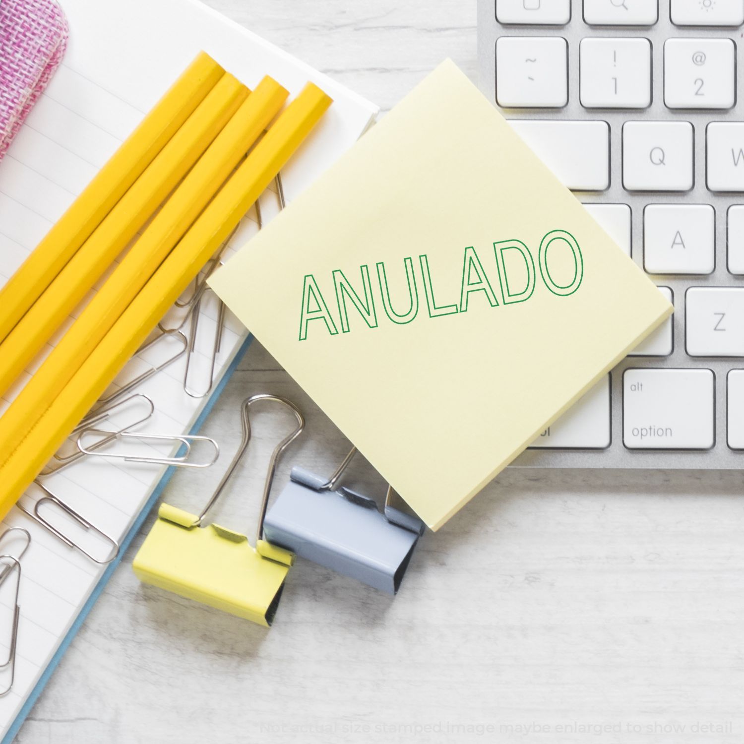 ANULADO word on beige label with office stationery and keyboard keys, indicating a canceled document or voided status for paperwork.