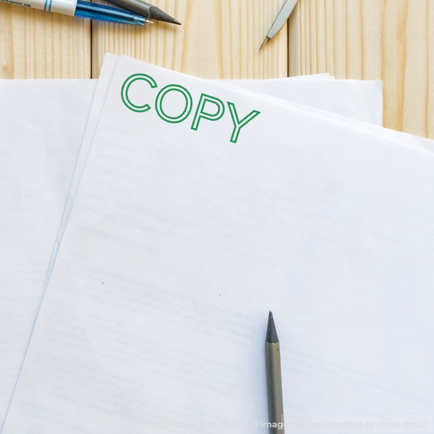 Office desk with COPY label on paper and pen, illustrating document copying and copying services.