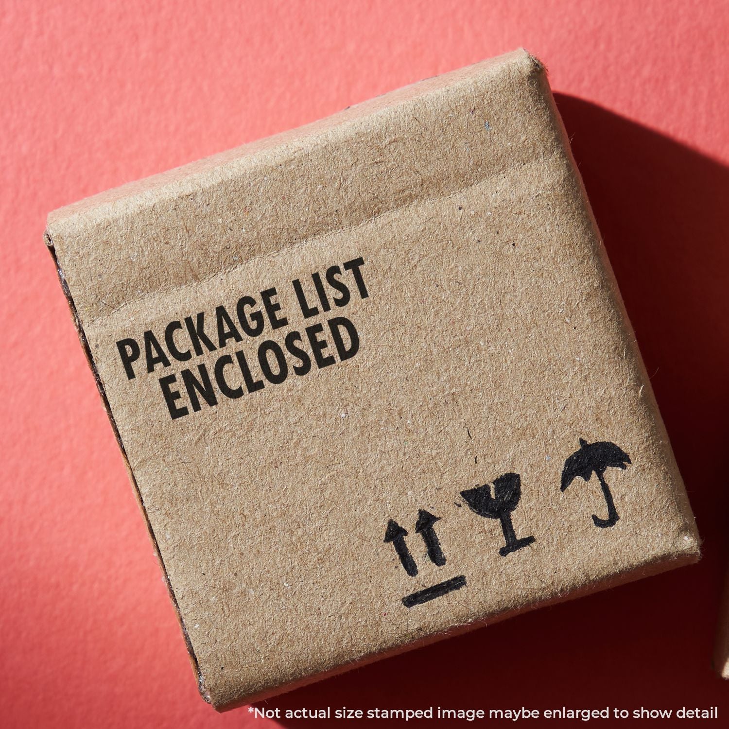 Cardboard shipping box labeled Package List Enclosed with fragile handling symbols on a red background.