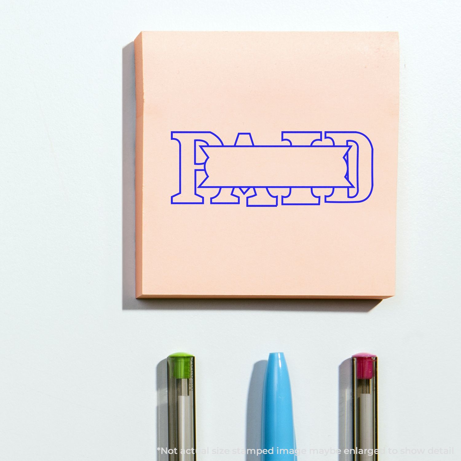 Blue stamp-style design on stationery paper with pens below, representing branding, printing, and writing tools for marketing materials and education.