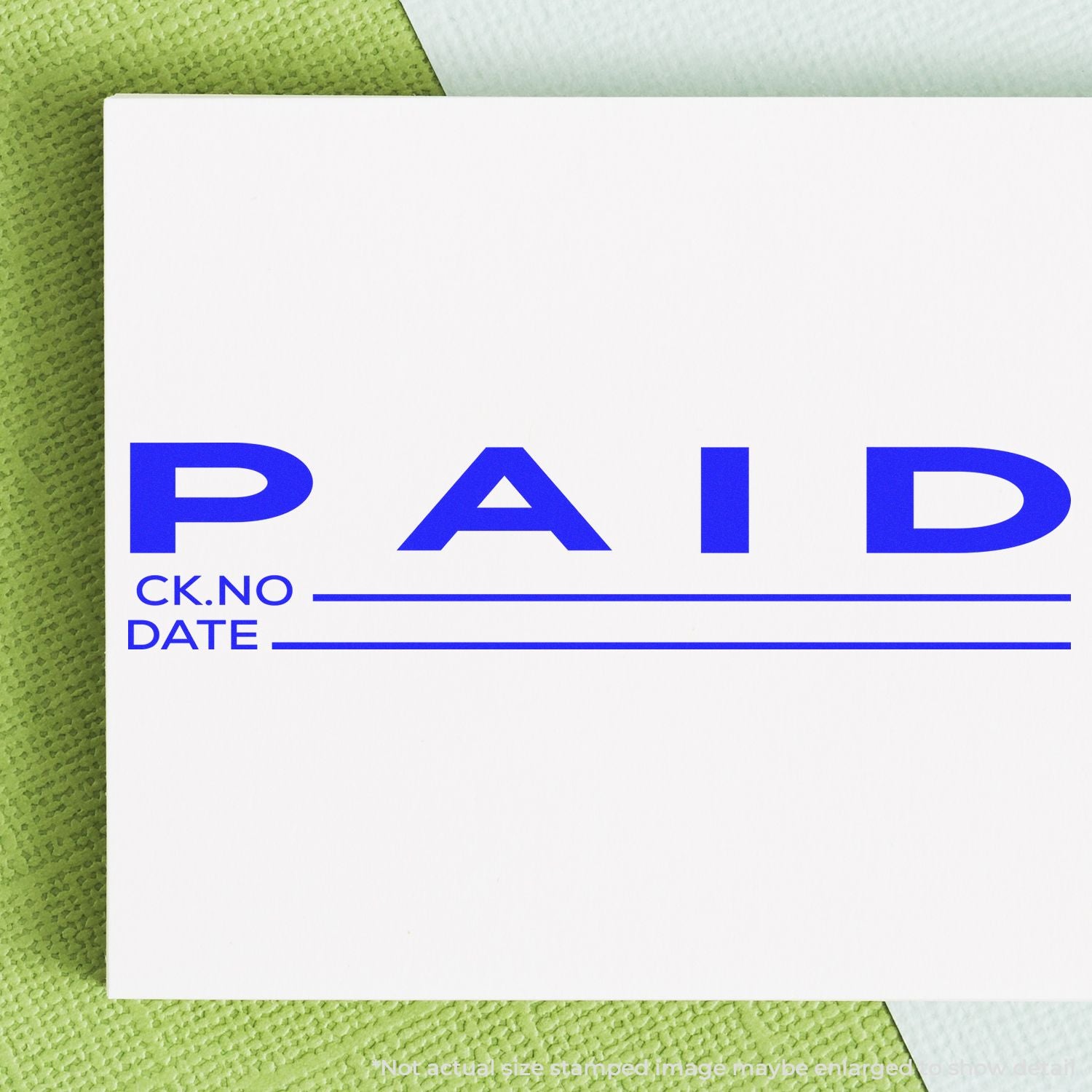 Blue PAID stamp on check payment document, showing check number (CK.NO) and date for accounting records.