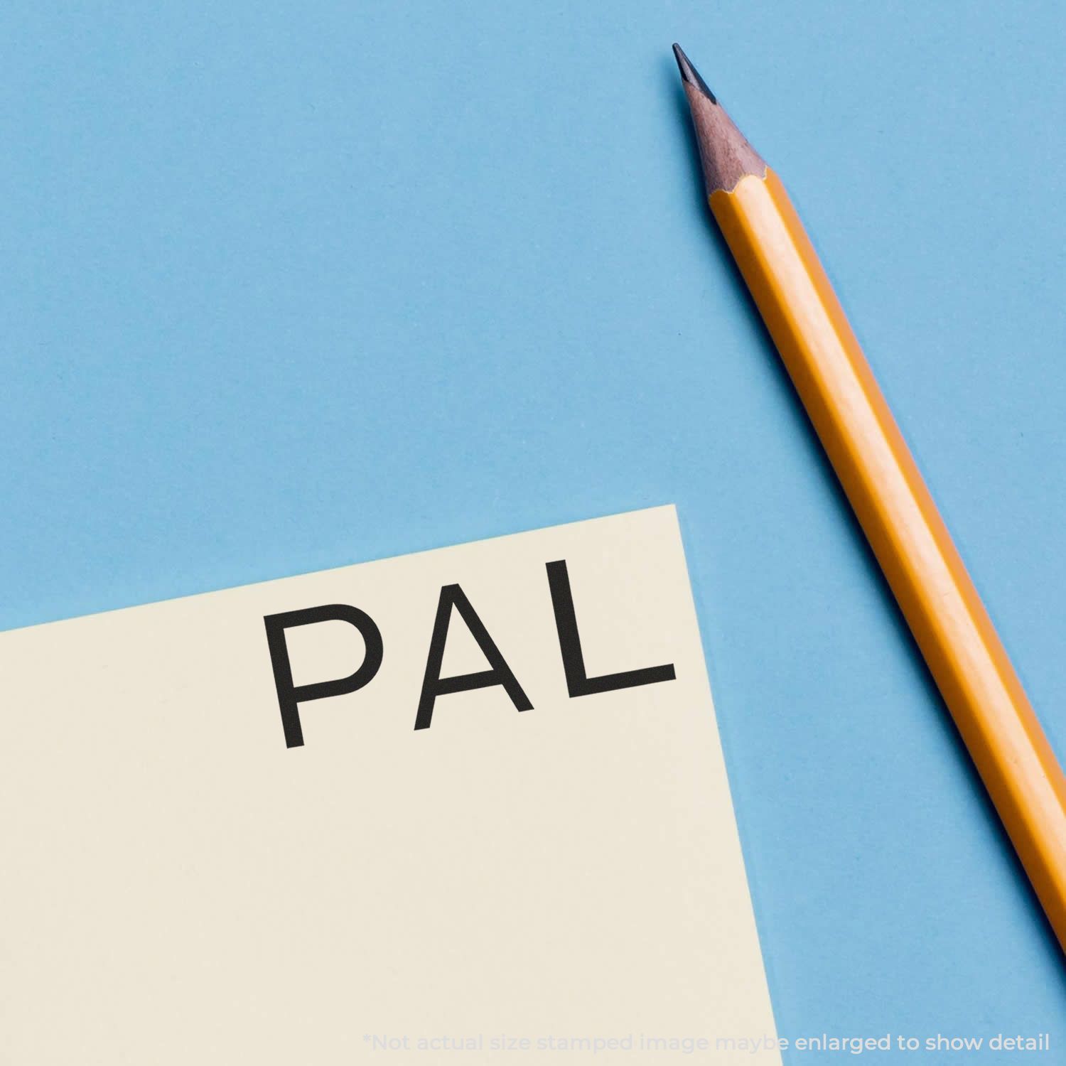 Pencil beside a paper reading PAL, symbolizing spelling practice, handwriting, and writing skills.