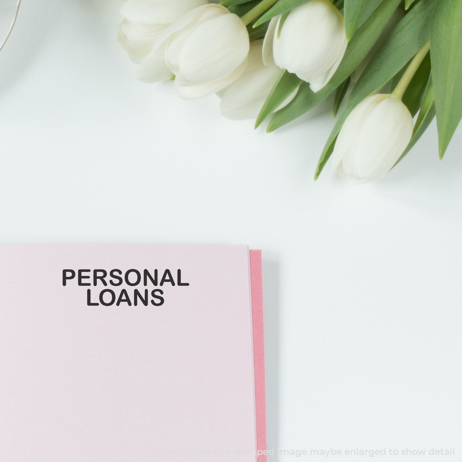 Fresh white tulips above a clean banner that says Personal Loans, promoting financing options for individual needs and debt relief