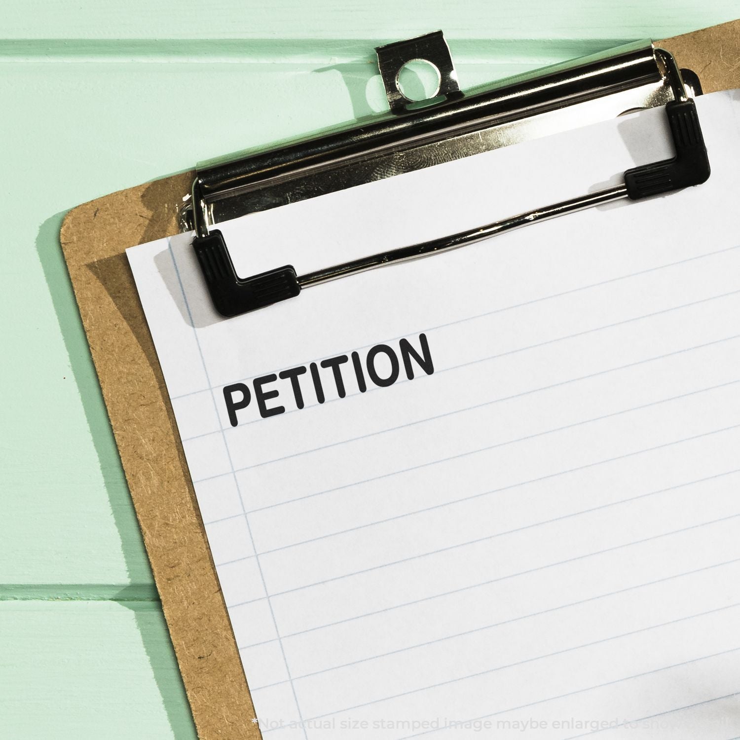 Clipboard with petition form on lined paper, concept of signing a legal petition.