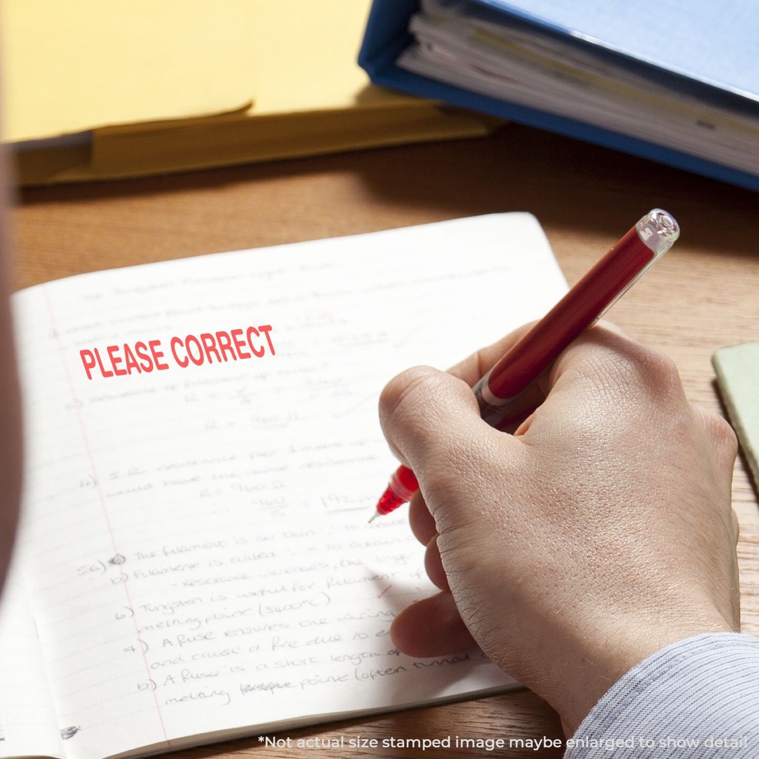 Hand writing with a red pen on an exam paper showing Please Correct stamp for educational feedback and corrections