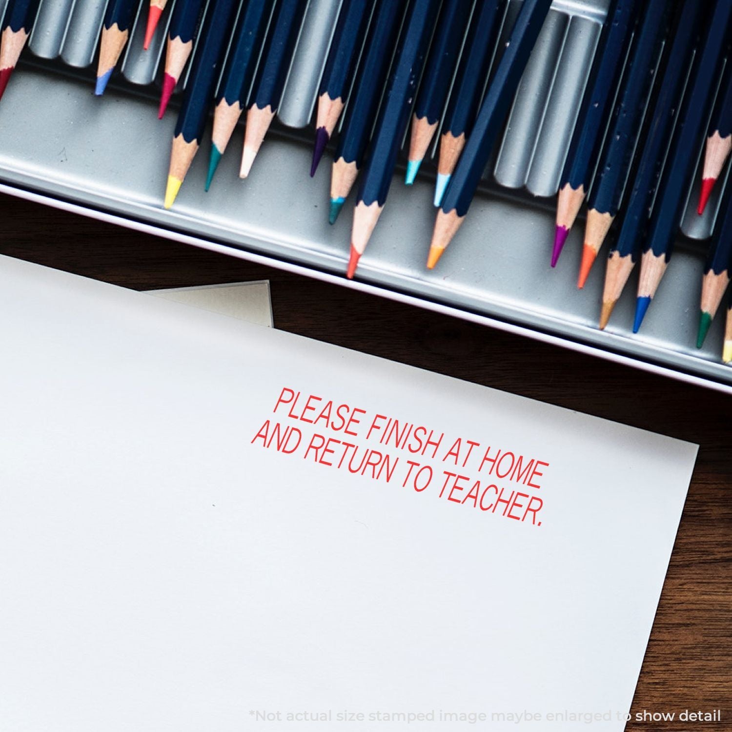 Colored pencils in a tin with a homework sheet stamped Please finish at home and return to teacher on a desk.
