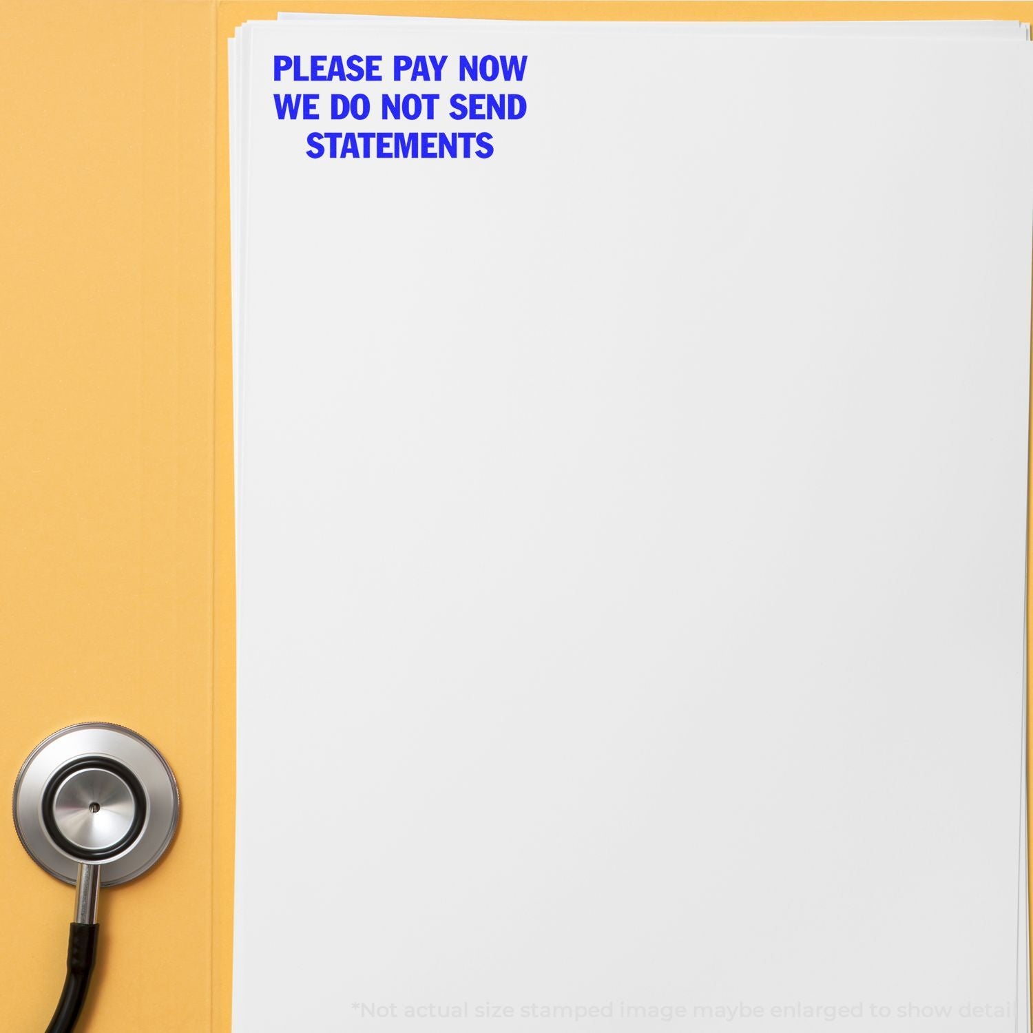 Close-up of a medical billing reminder with Please pay now, we do not send statements stamped on paper and a stethoscope on a yellow background.