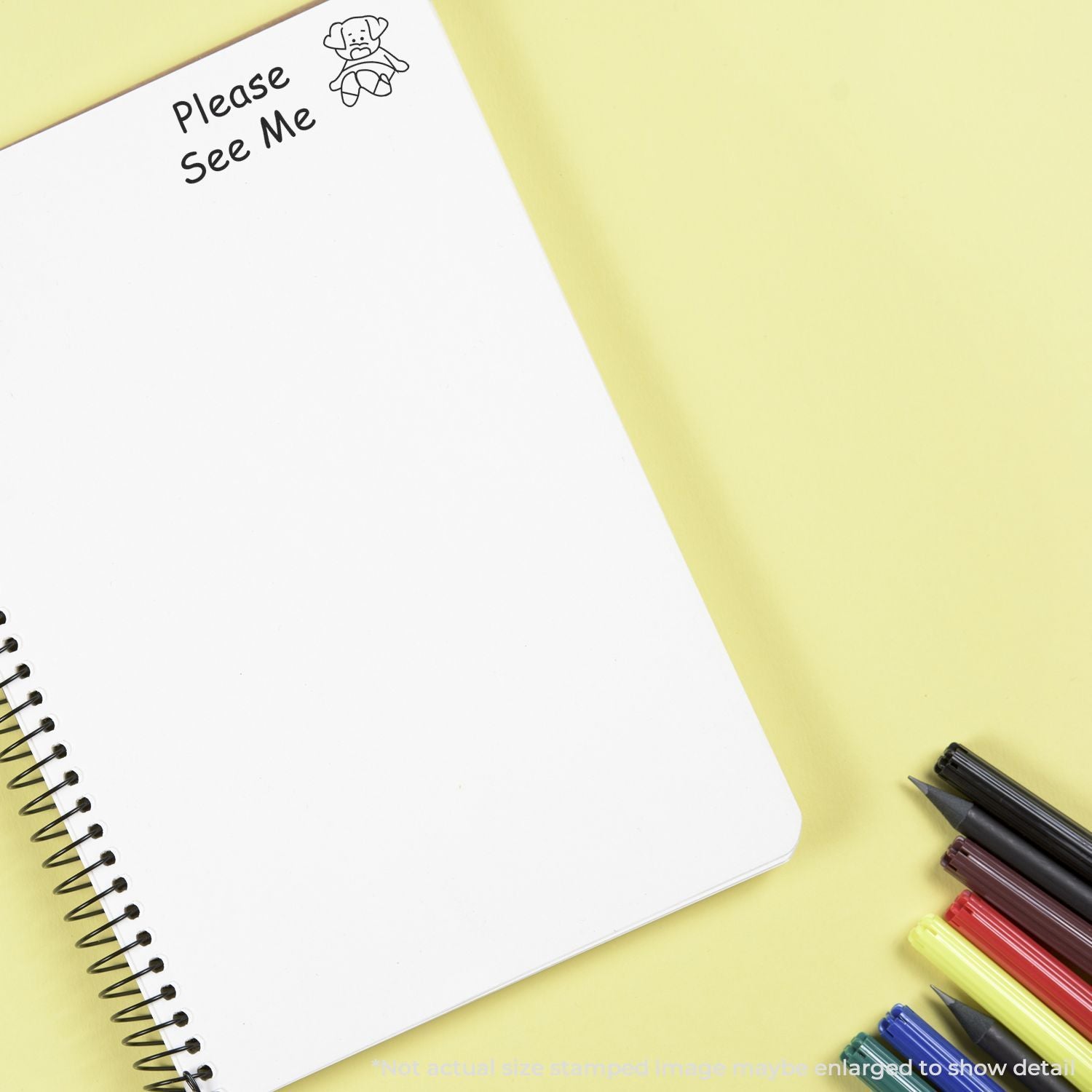 Open notebook with Please See Me message and doodle, on a yellow stationery backgroundprompt for study notes or creative writing.