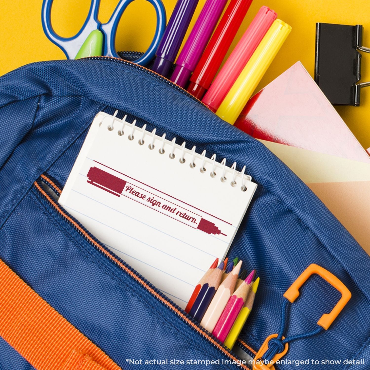 Blue school backpack with colorful pens, pencils, scissors, notebook and Please sign and return note for back-to-school organization