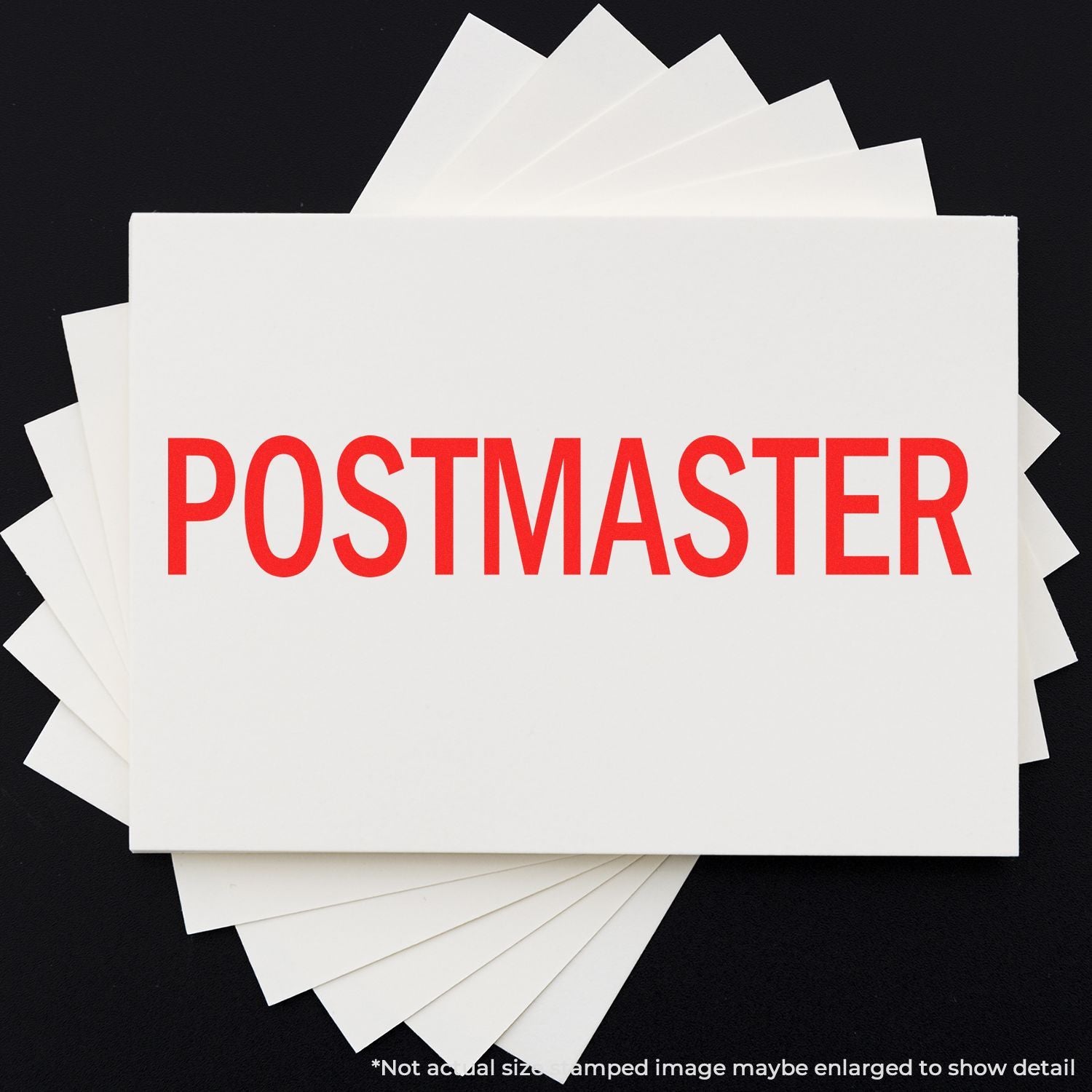 Stack of white mail cards with red POSTMASTER text on dark background, representing postal service leadership and mail management.