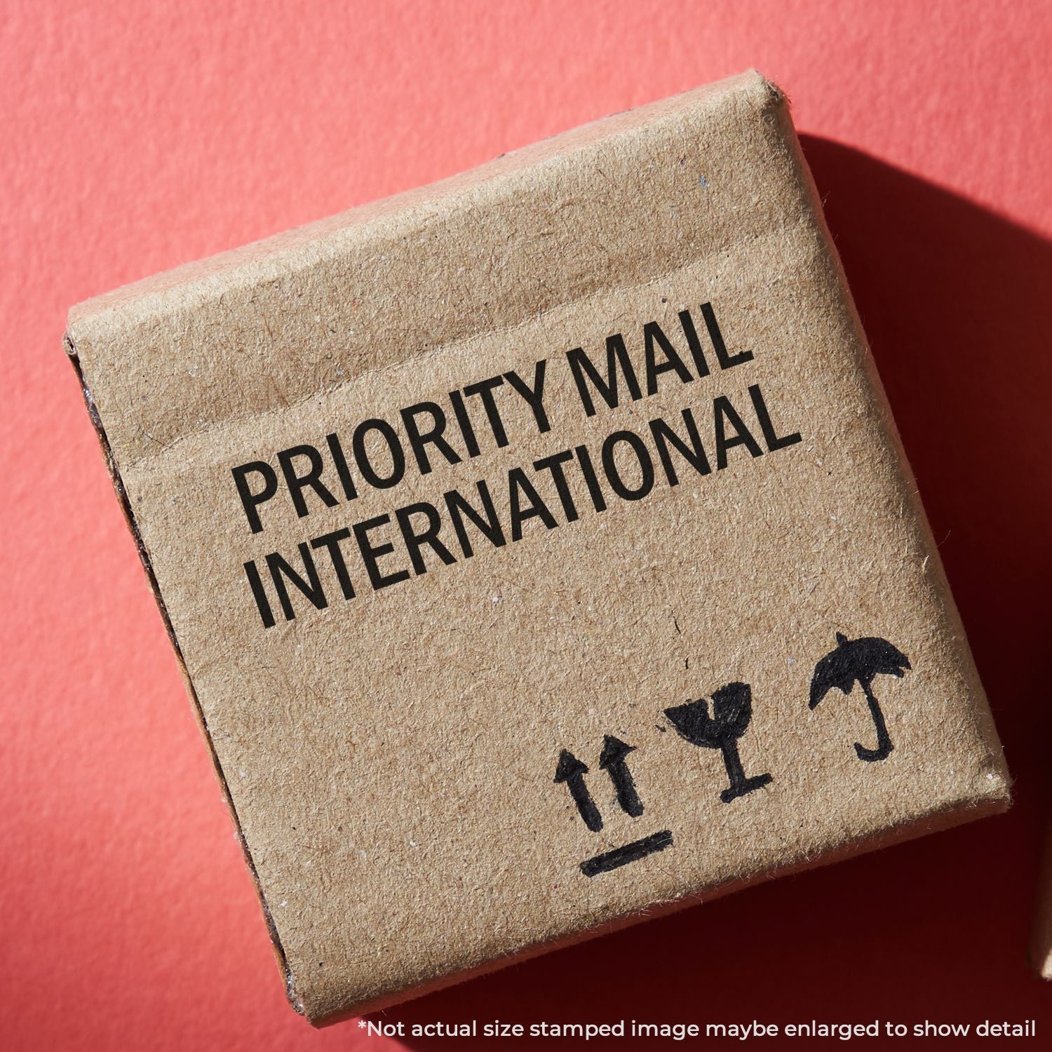 Close-up of Priority Mail International stamp on a shipping package, highlighting international delivery and mailing service label.