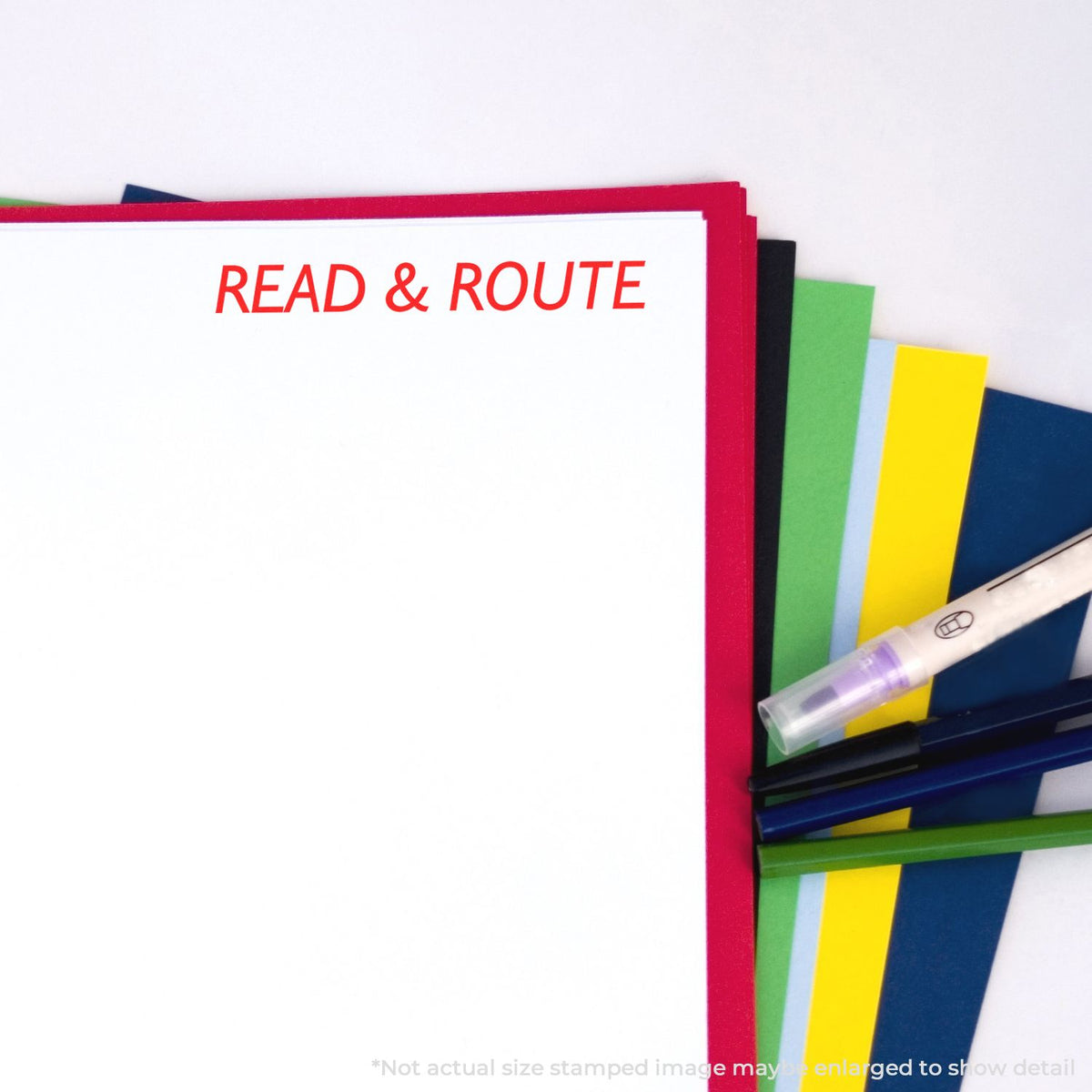Stack of colorful classroom books and stationery with READ & ROUTE heading, promoting literacy, reading, and learning resources.