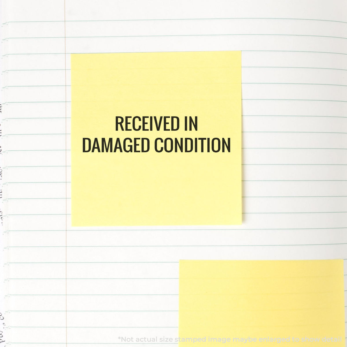 Yellow note reading Received in damaged condition on lined paper, documenting damaged shipment receipt for claims.