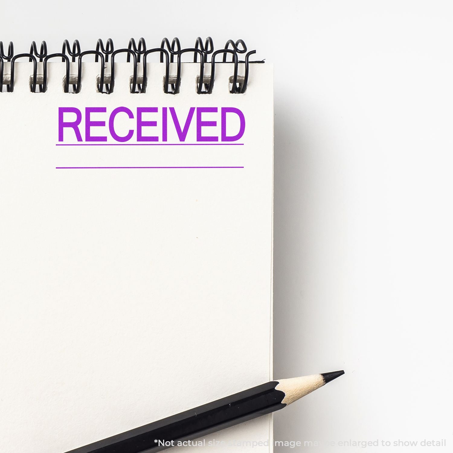 Received confirmation note with binder clips and pencil, showing RECEIVED for document status and record keeping.