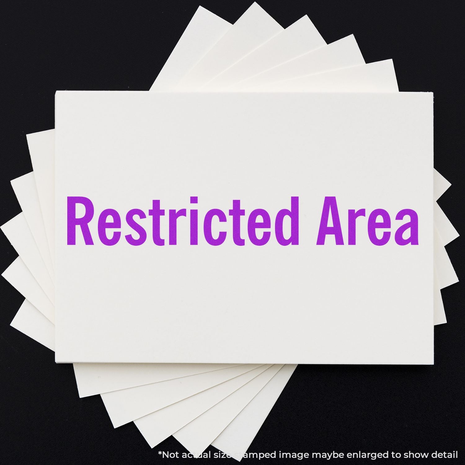 Stack of white cards with bold purple Restricted Area text on a black background.