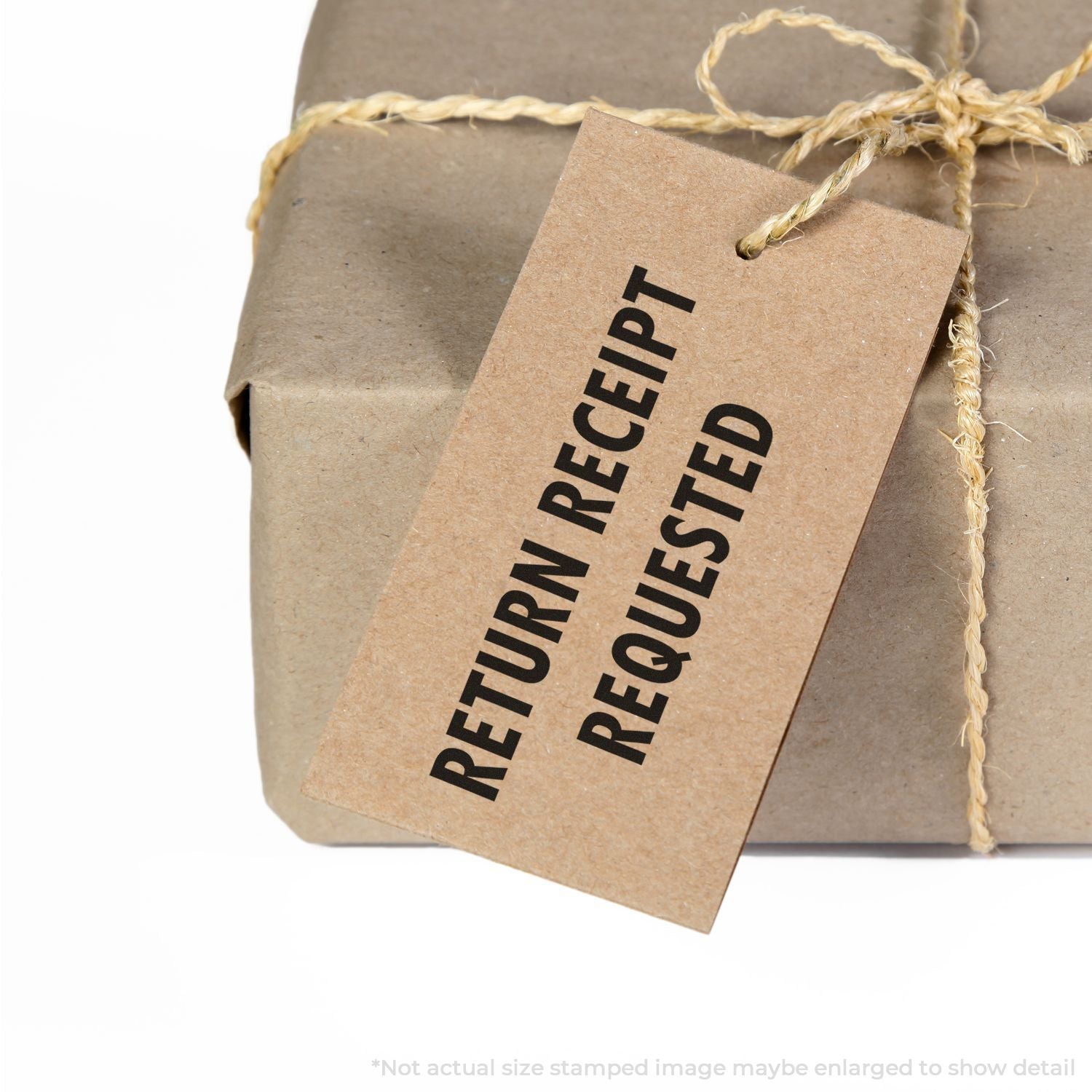 Brown kraft paper gift wrapped with twine and a “Return Receipt Requested” tag, eco-friendly parcel packaging close-up.