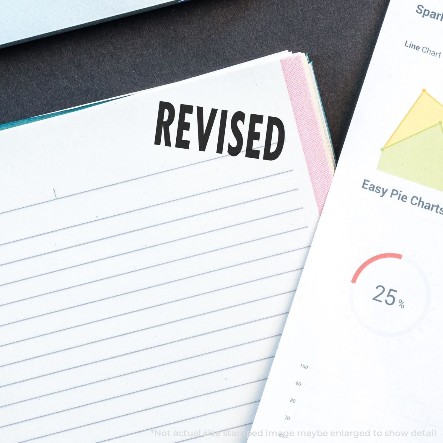 Revised document concept with analytics charts and reports on desk, highlighting updated data for business dashboard reporting.