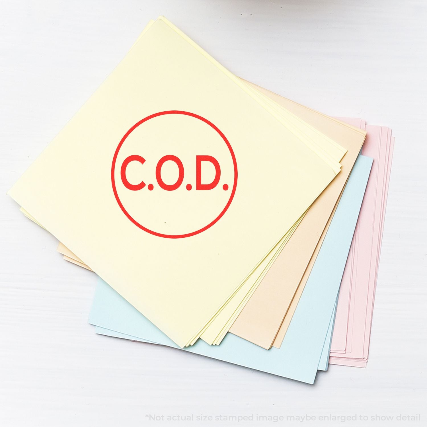 C.O.D. stamped on stack of pastel colored file folders and documents