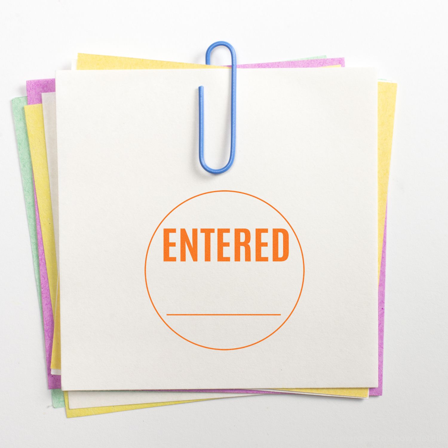 Stack of colorful paper notes clipped together with a blue paperclip and stamped ENTERED on a white background.