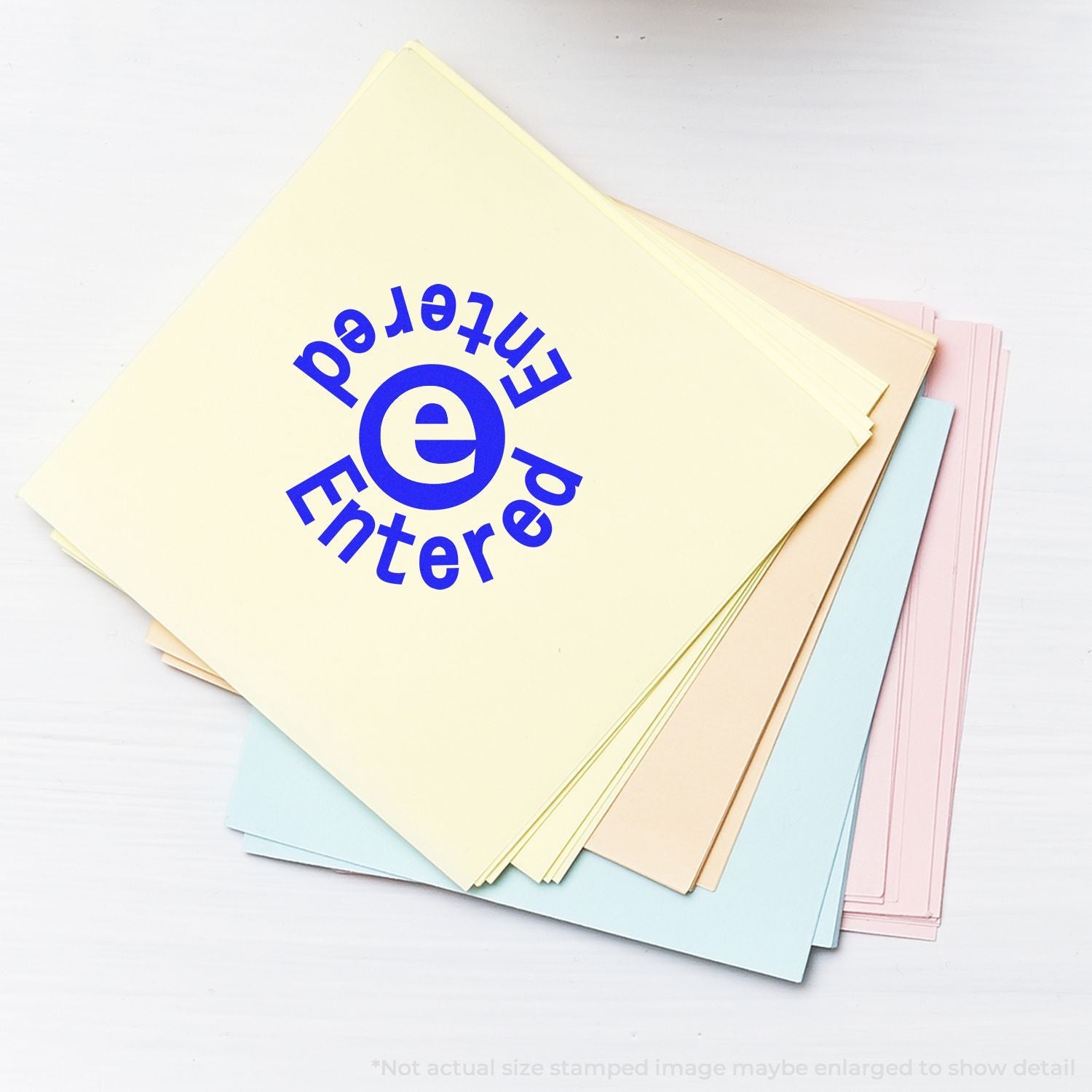 Stack of pastel file folders stamped Entered with a blue e icon