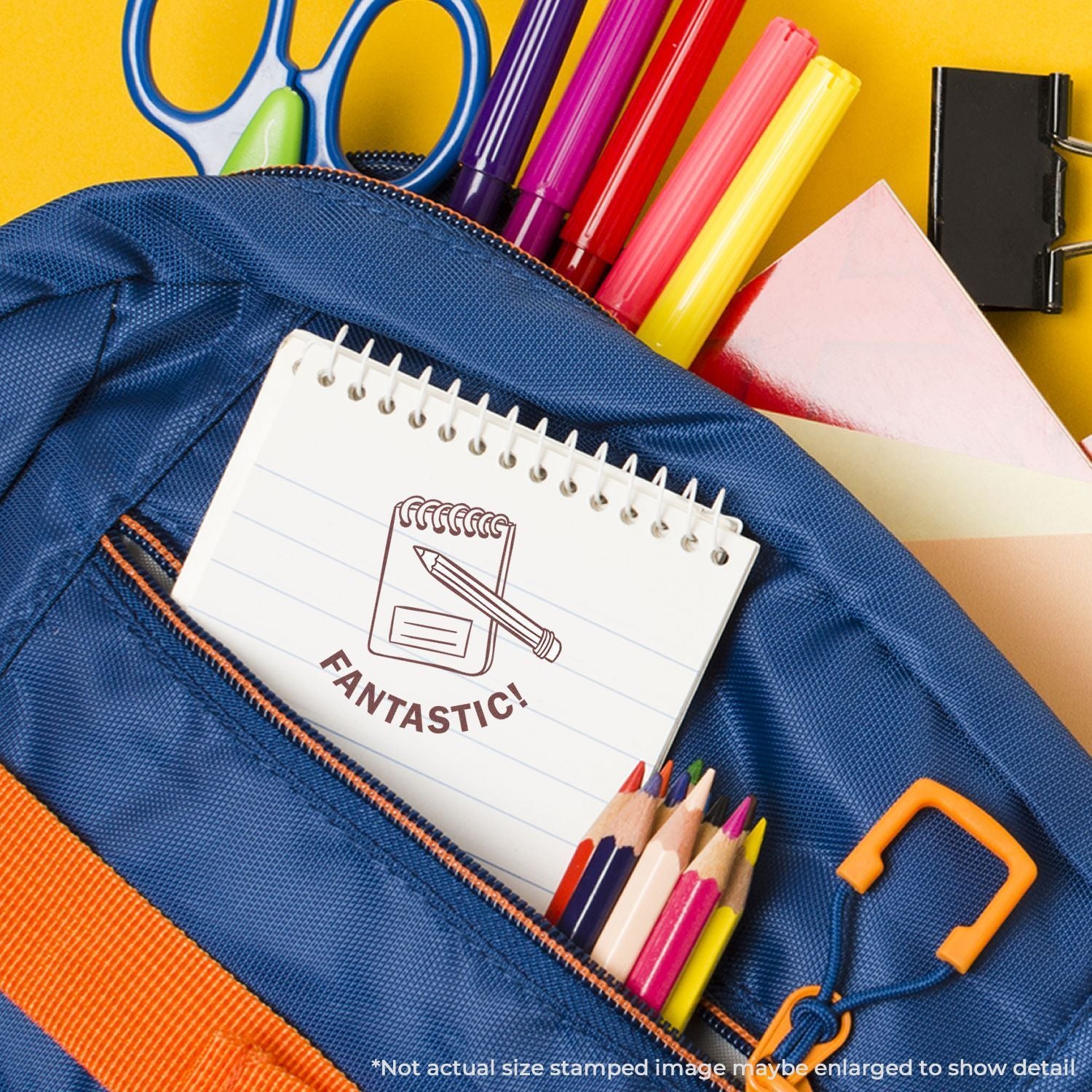 Colorful school backpack with notebook, pencils, markers, scissors, and stationery supplies on a yellow background.