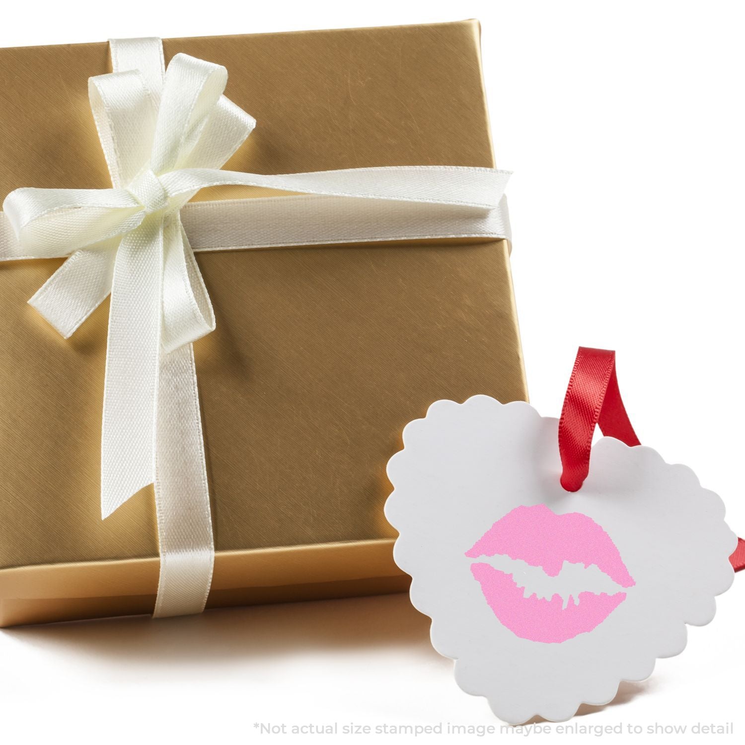Elegant wrapped gift box with white ribbon and pink lips kiss tag, romantic present packaging on white background