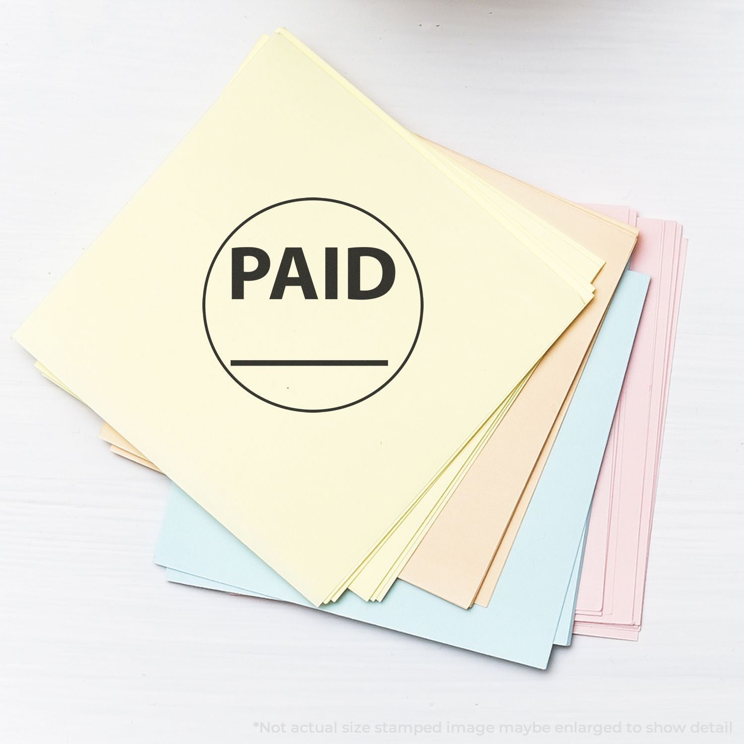 Pastel file folders stamped PAID, representing paid invoices and organized accounting documents.