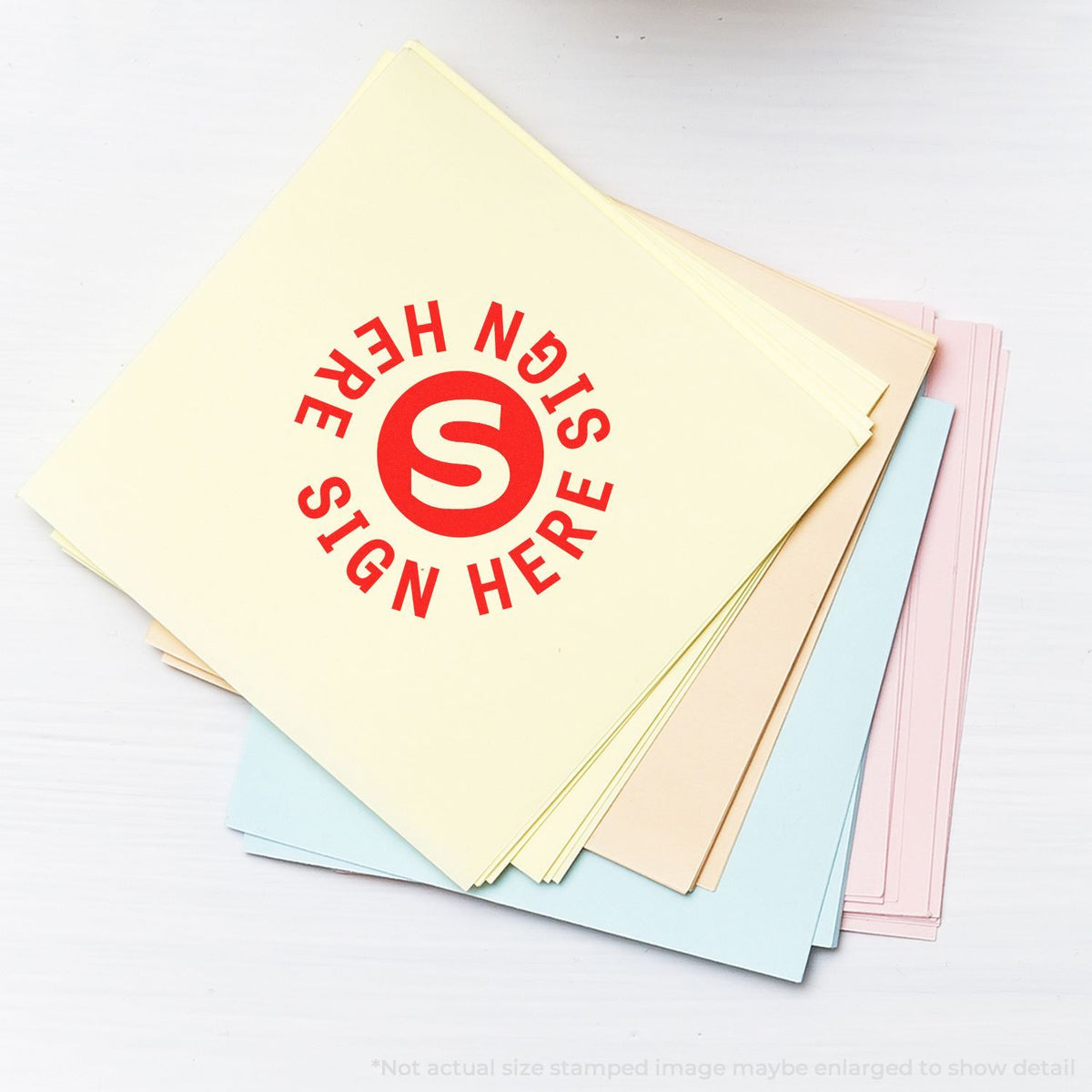 Stack of stationery notebooks showing red PRINT STAMPED 5 branding logo for printing and custom paper product marketing.