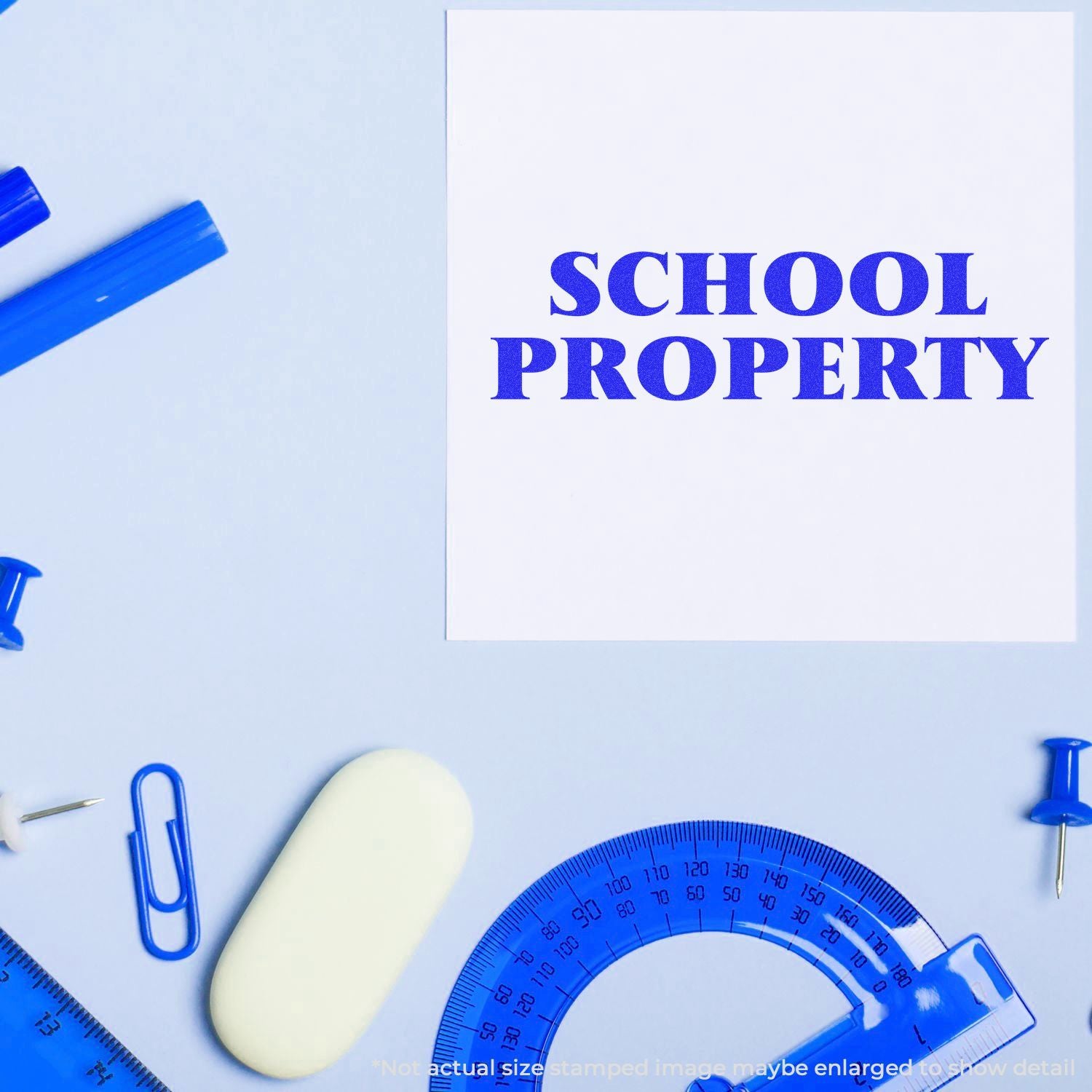 School property stamp with blue school supplies on a light blue background