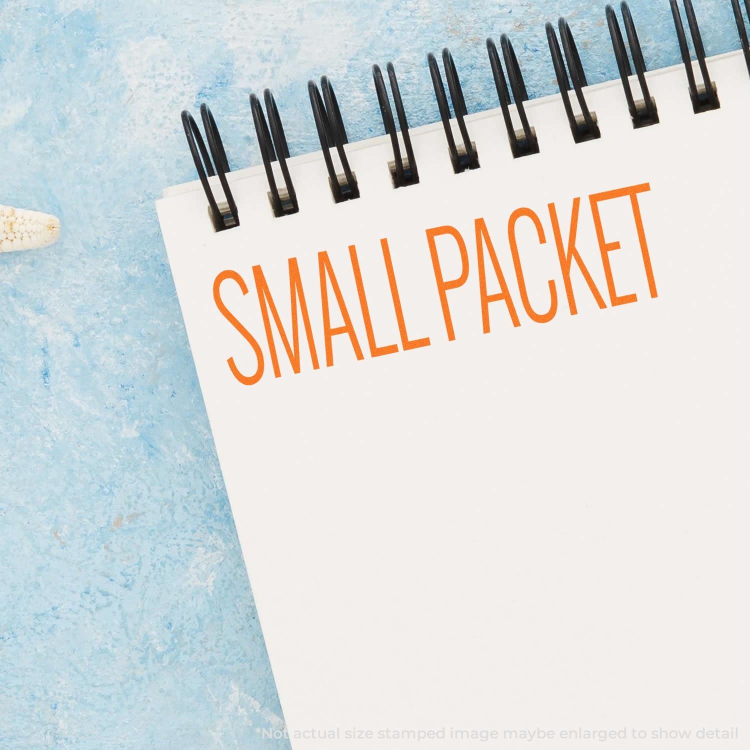 Small packet shipping label with SMALL PACKET text and black fastener pins on blue mailer background.