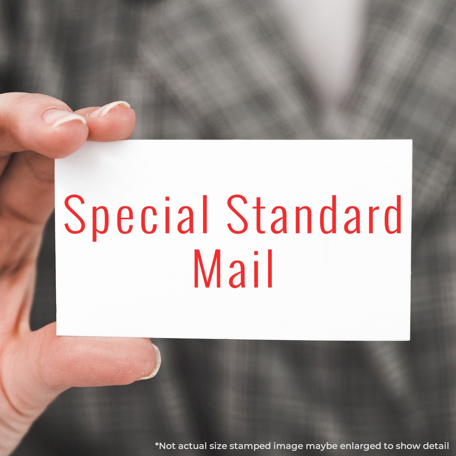 Hand holding card that says Special Standard Mail for postal shipping and mailing services.