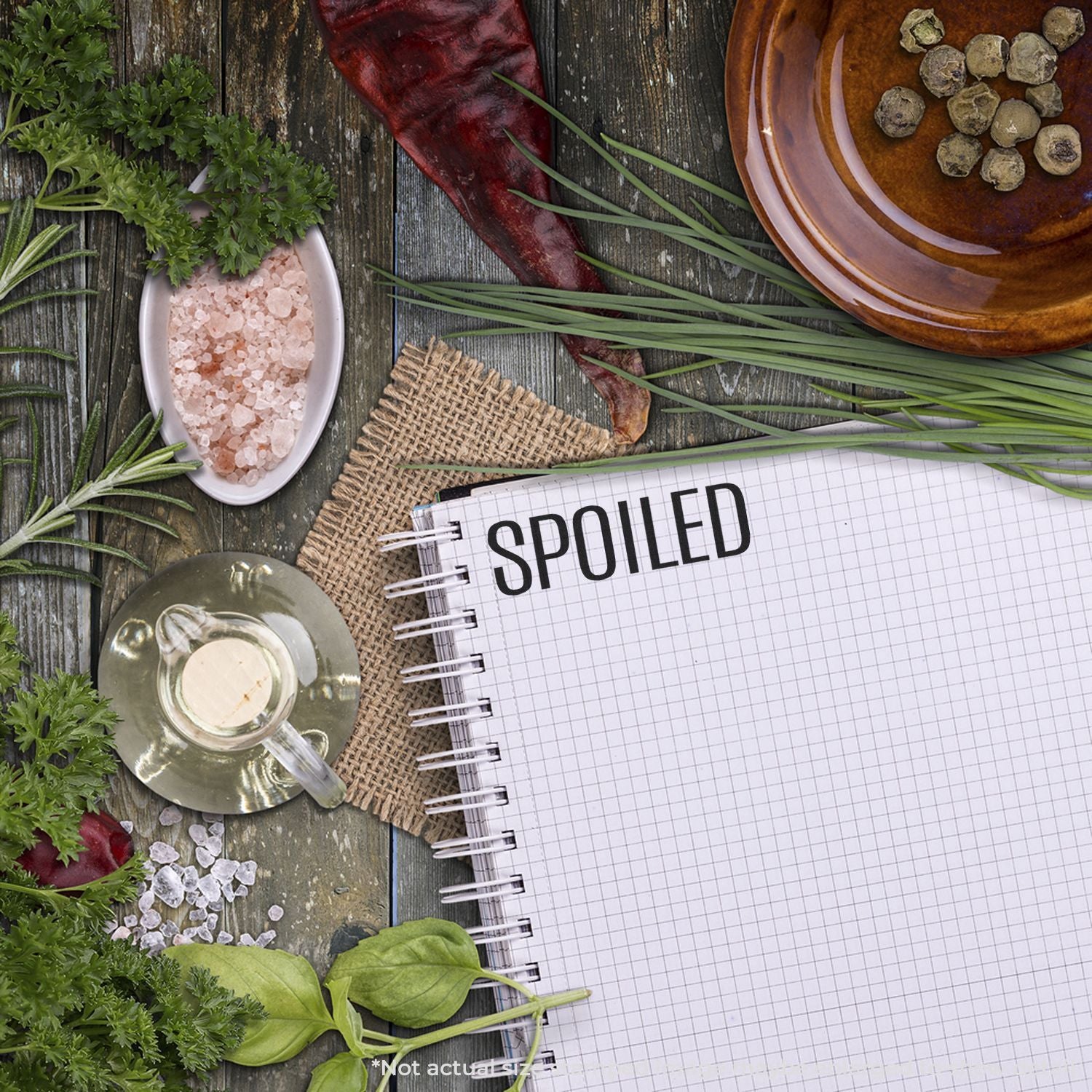 Spilled spices concept: notepad on rustic wood with herbs, sea salt, garlic and pepper, ideal for seasoning recipe branding
