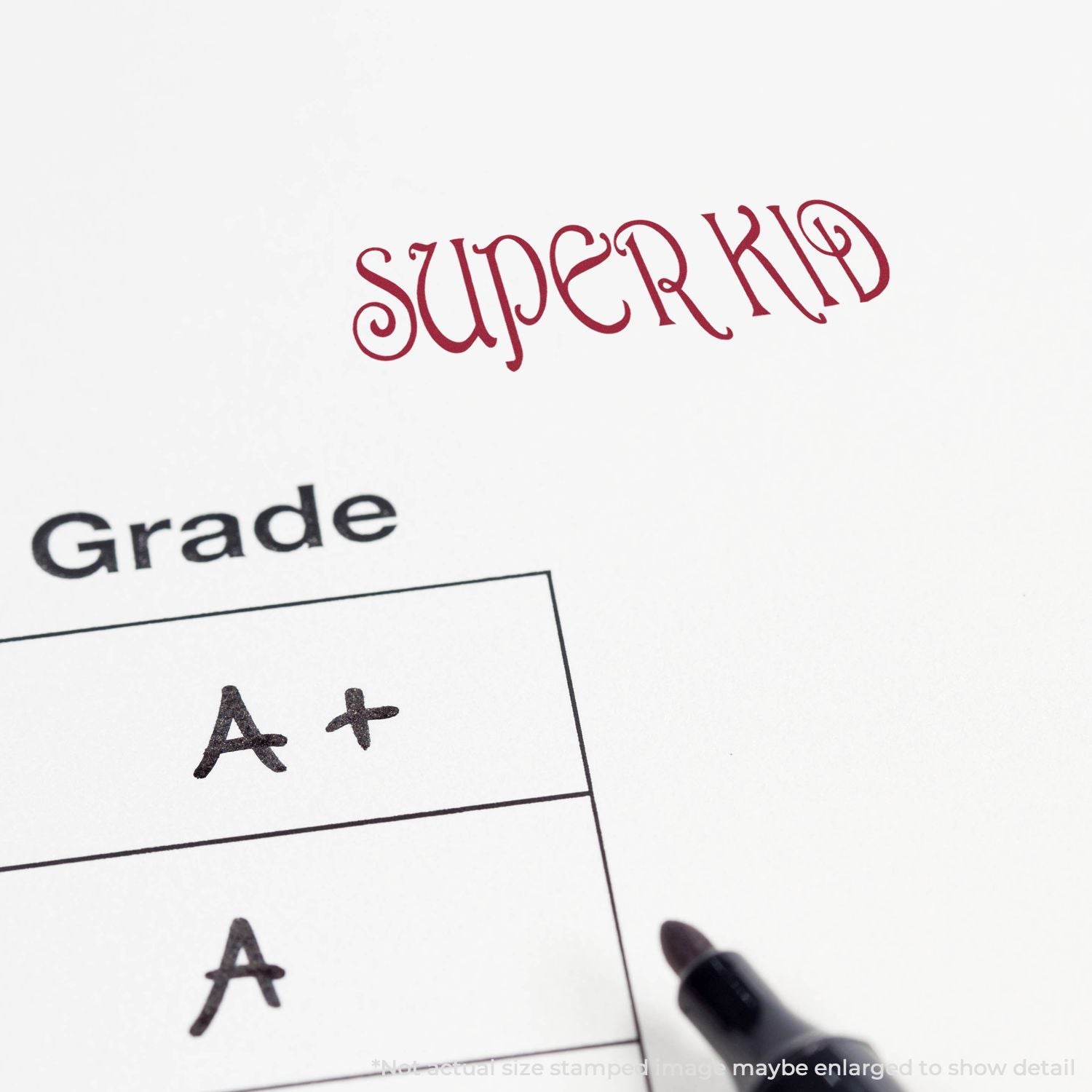 Super kid report card with A+ and A grades marked on paper beside a pen tip.