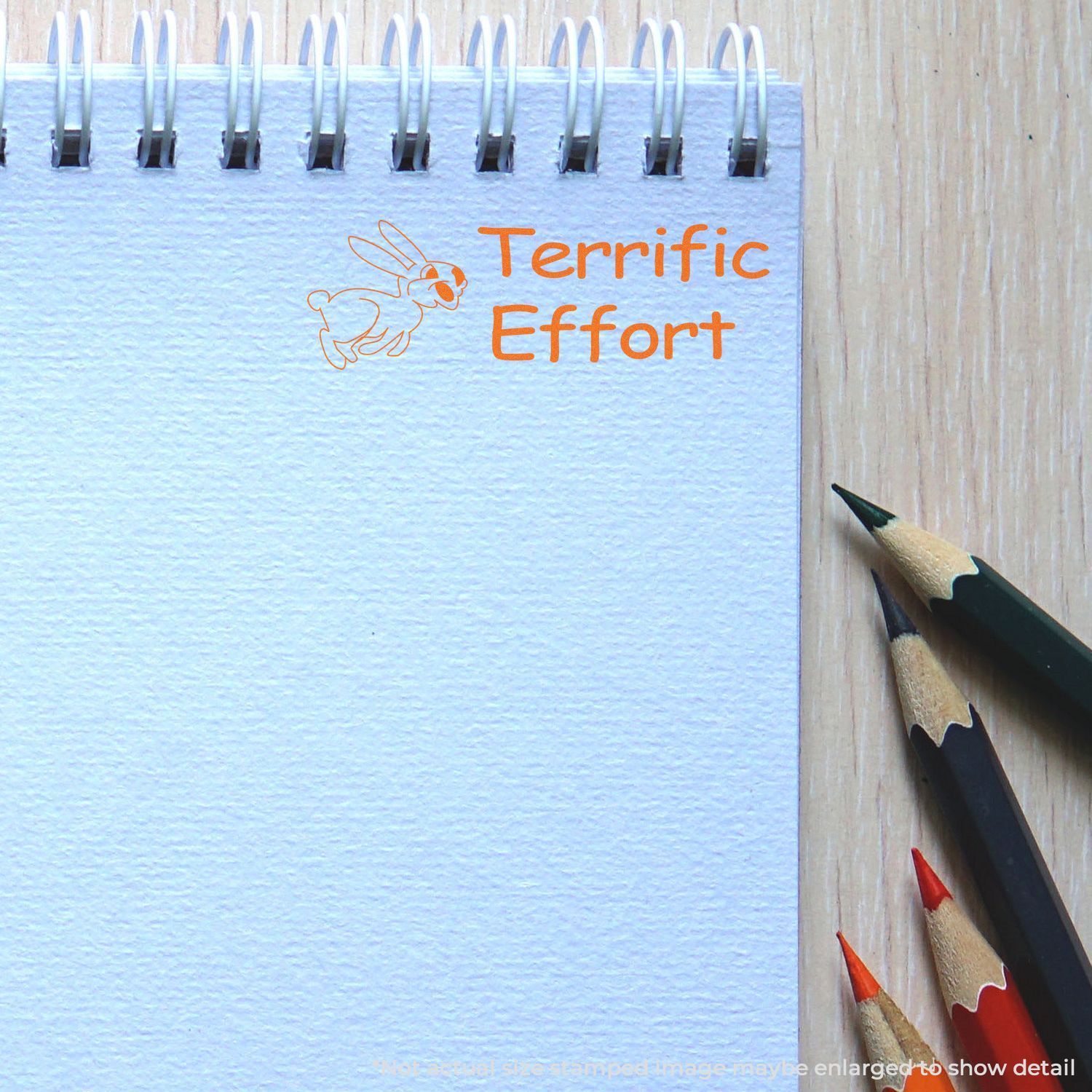 Terrific Effort classroom sign with cartoon rabbit and orange lettering, surrounded by colored pencilsmotivational education display.