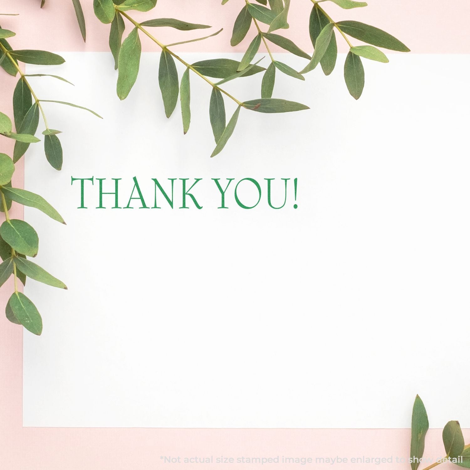 Elegant thank you card with green eucalyptus leaves border and blank white space on a soft pink background.