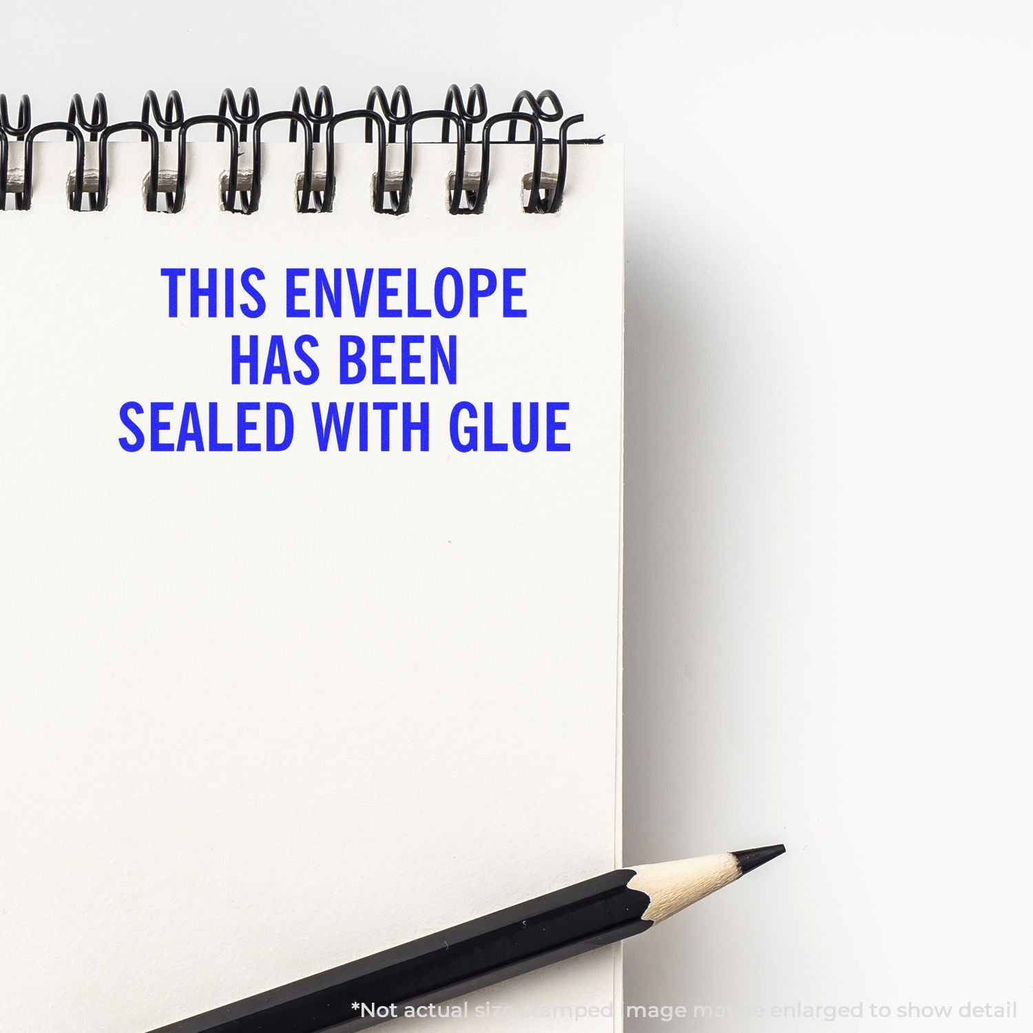 Glue-sealed envelope for tamper-evident mailing, with text This envelope has been sealed with glue and a pencil.