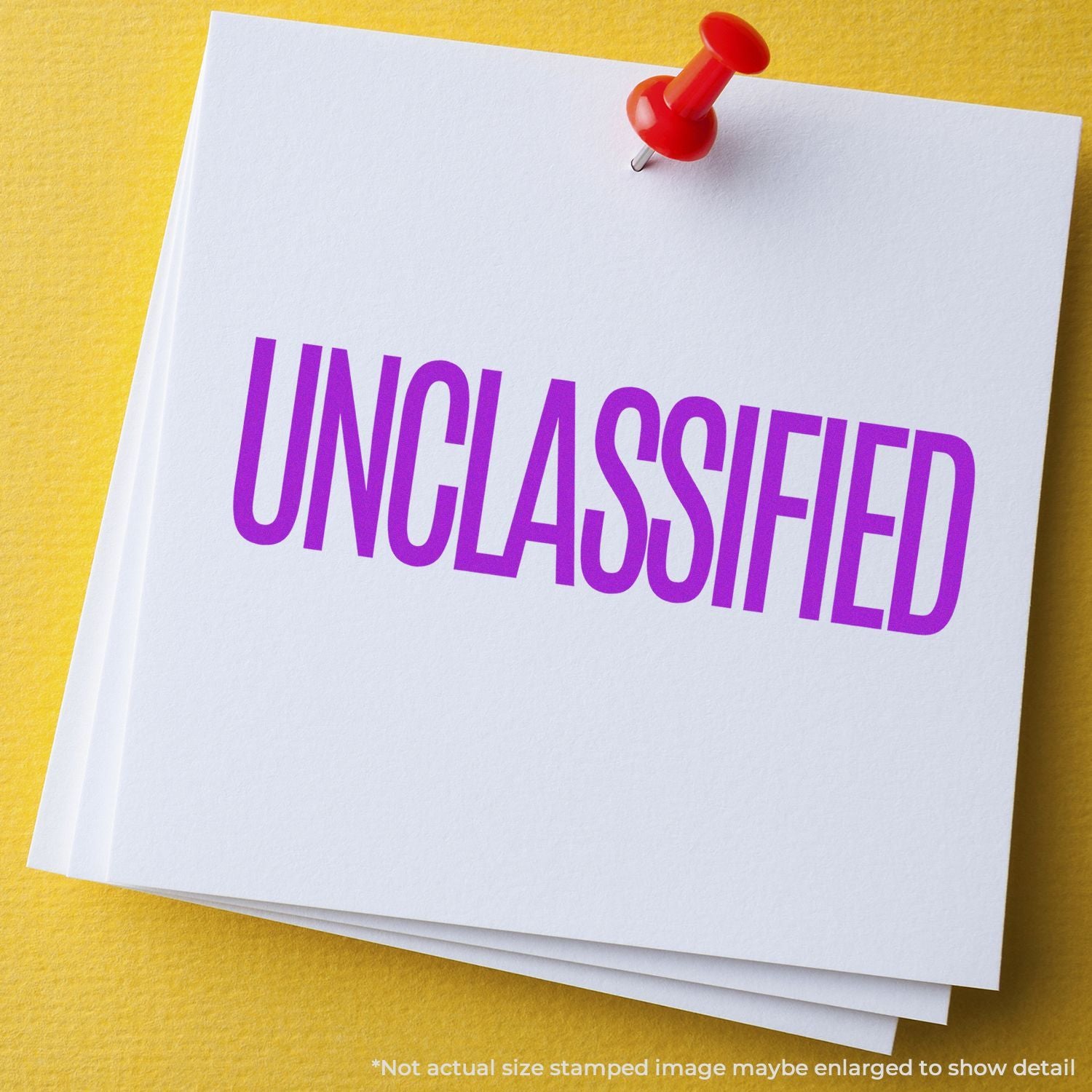 Unclassified document with red pushpin on white paper over yellow background.