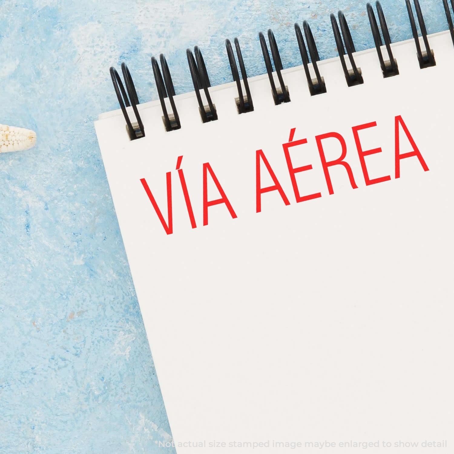 Notebook with red Va Area text, medical airway concept on a white spiral notepad with blue background.