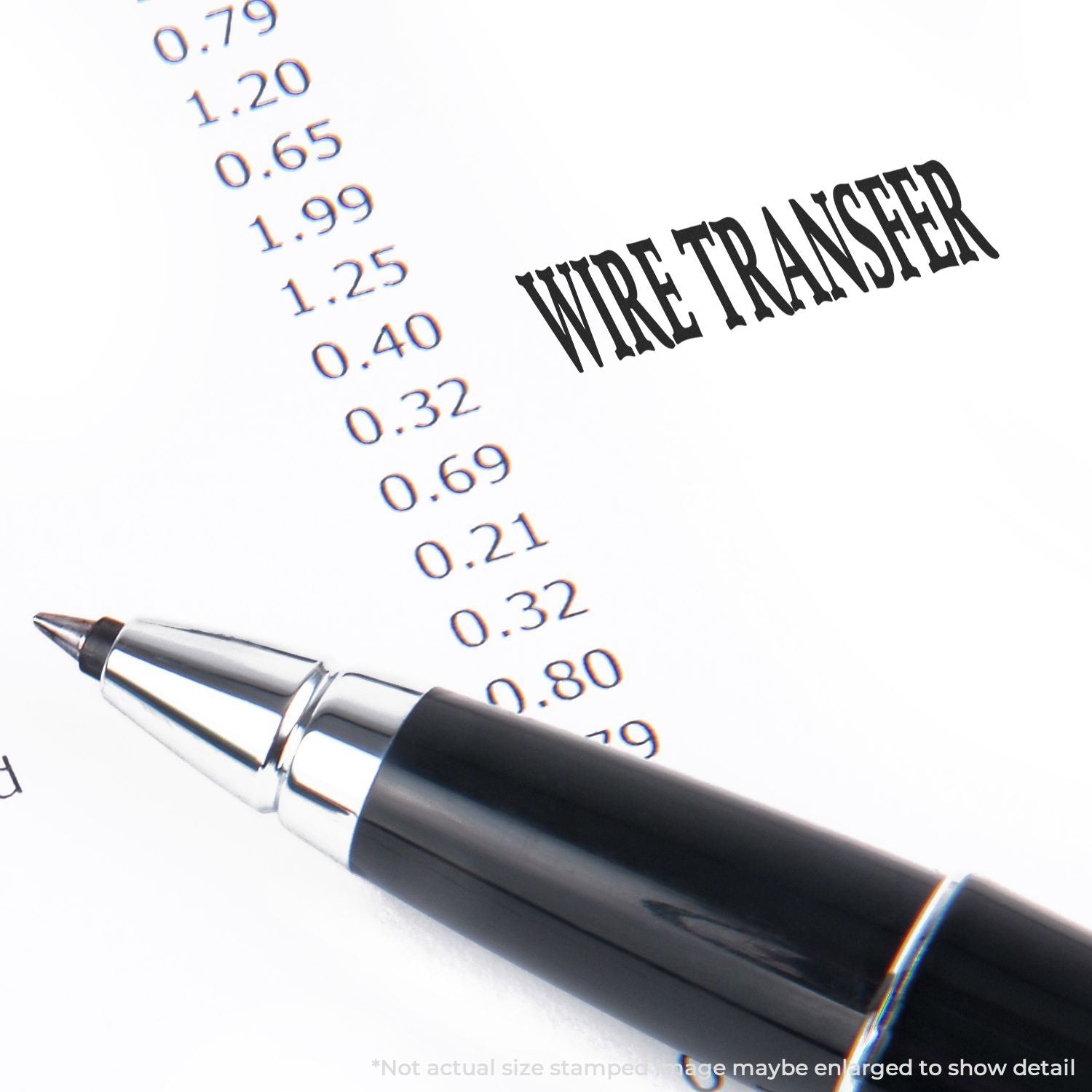 Black pen on a wire transfer form with transaction amounts, financial paperwork and banking document close-up.