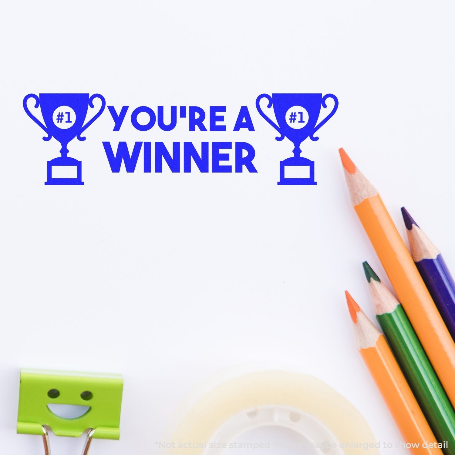 Youre a Winner motivational graphic with blue trophy icons and colorful pencils on a white background.