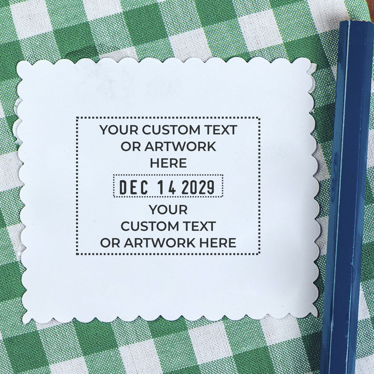 Scalloped white custom text card with date on green gingham tablecloth beside a blue pencil, personalized printable template mockup.