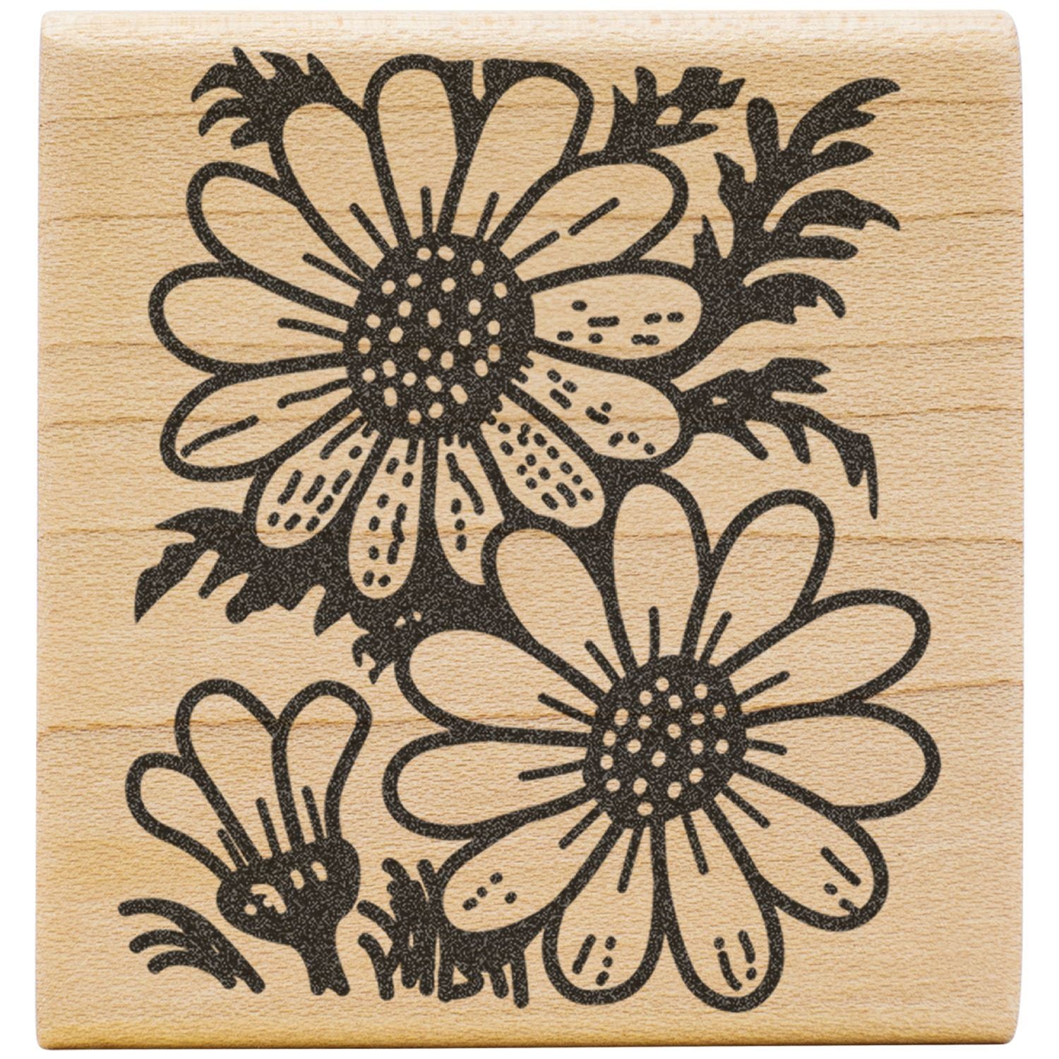 Black floral rubber stamp with daisy flower design on a wooden block, vintage botanical art print.
