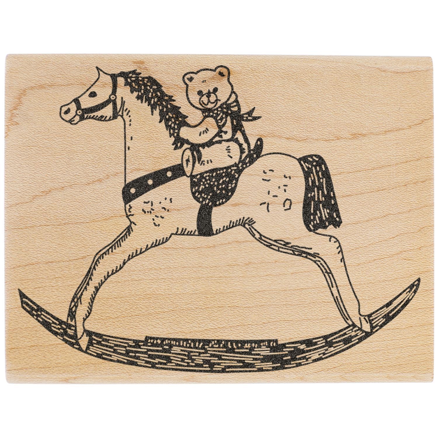 Wooden rubber stamp with vintage horse and teddy bear rocking horse design on a natural wood background.
