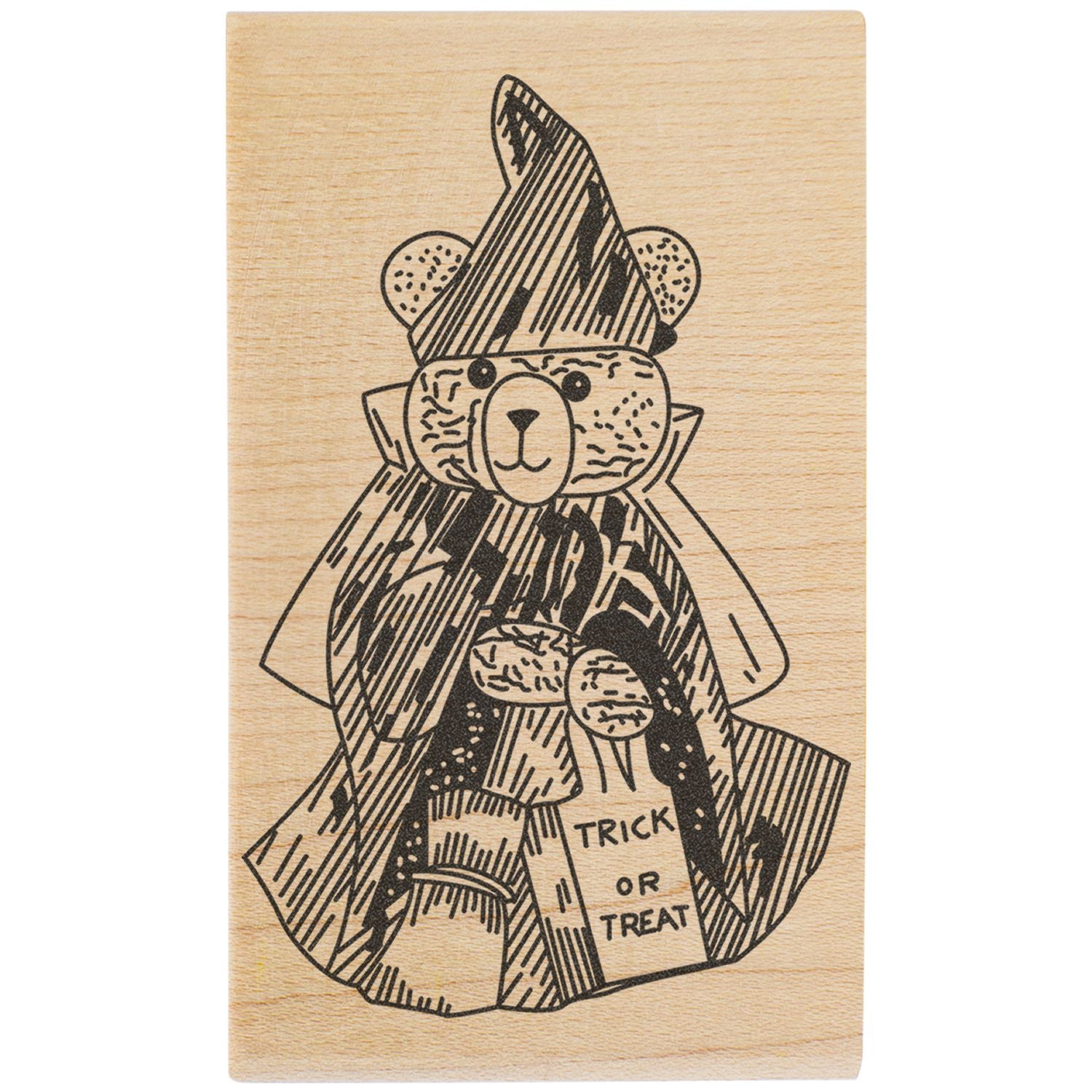 Wooden Halloween stamp of a teddy bear in costume holding a trick or treat bag.